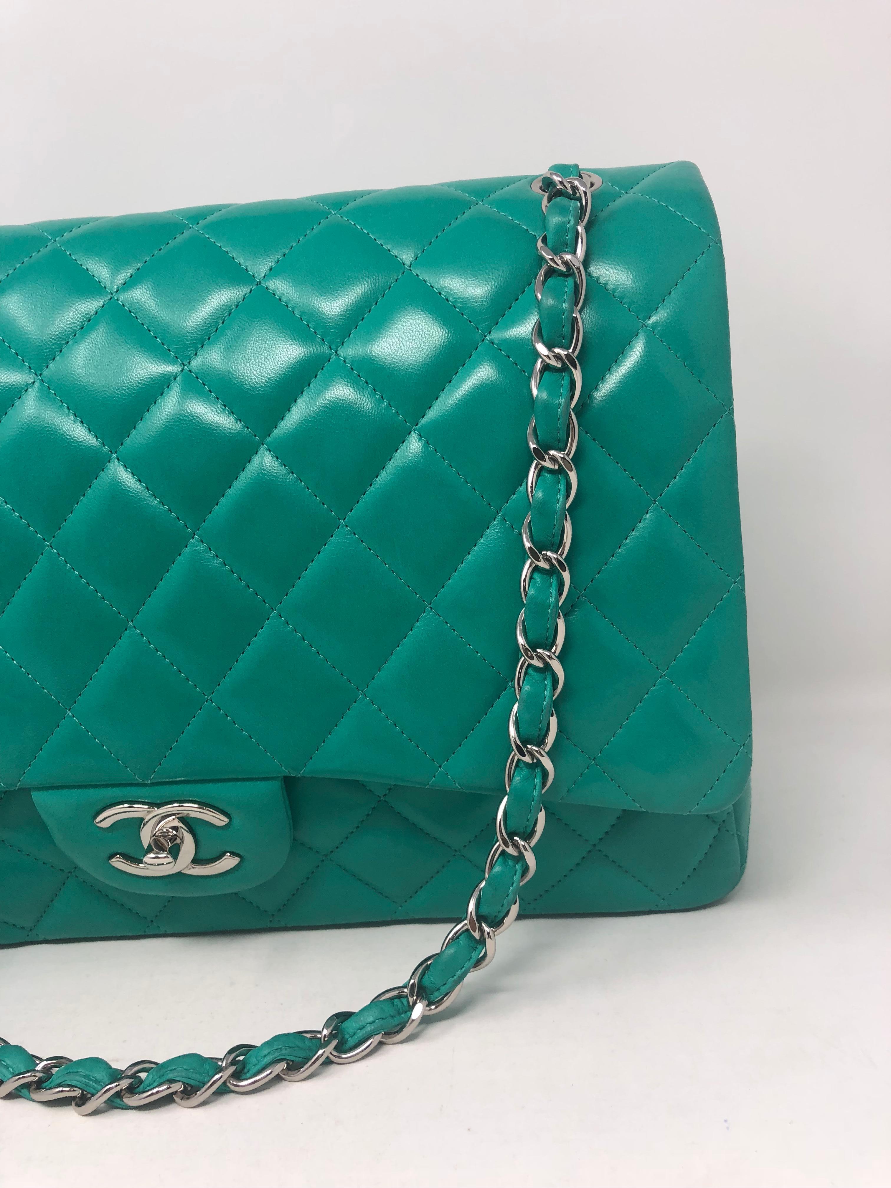 Chanel green menthe leather Maxi double flap bag. Beautiful minty green lambskin leather. Can be worn doubled or as a crossbody. Guaranteed authentic. 