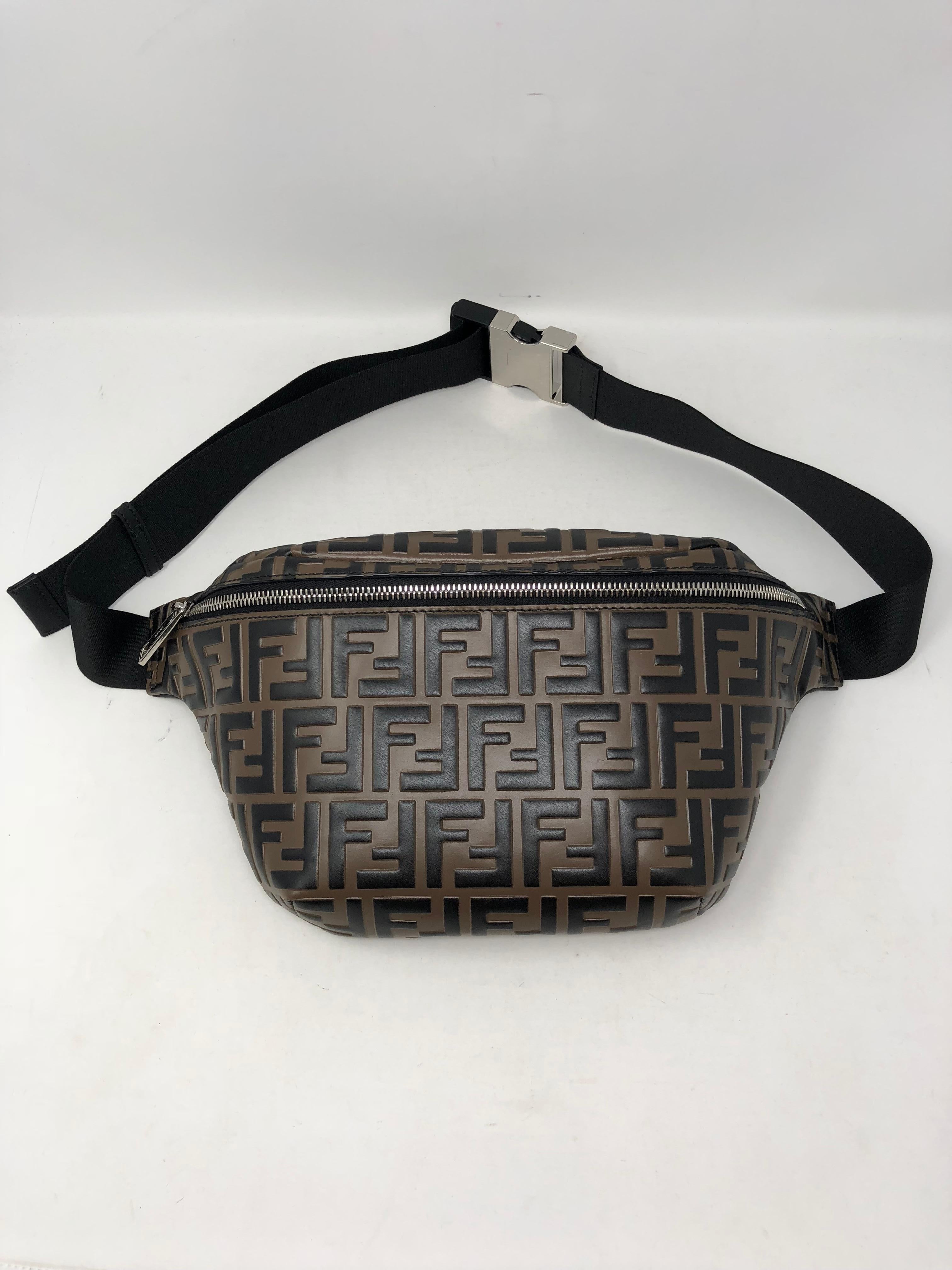 Fendi Embossed Belt Bag. Leather belt bag/fanny pack with Fendi logo embossed finish. Adjustable belt buckle strap. Made in Italy. Brand new. Hard to get now. Most wanted fanny pack and sling bag. Guaranteed authentic. 