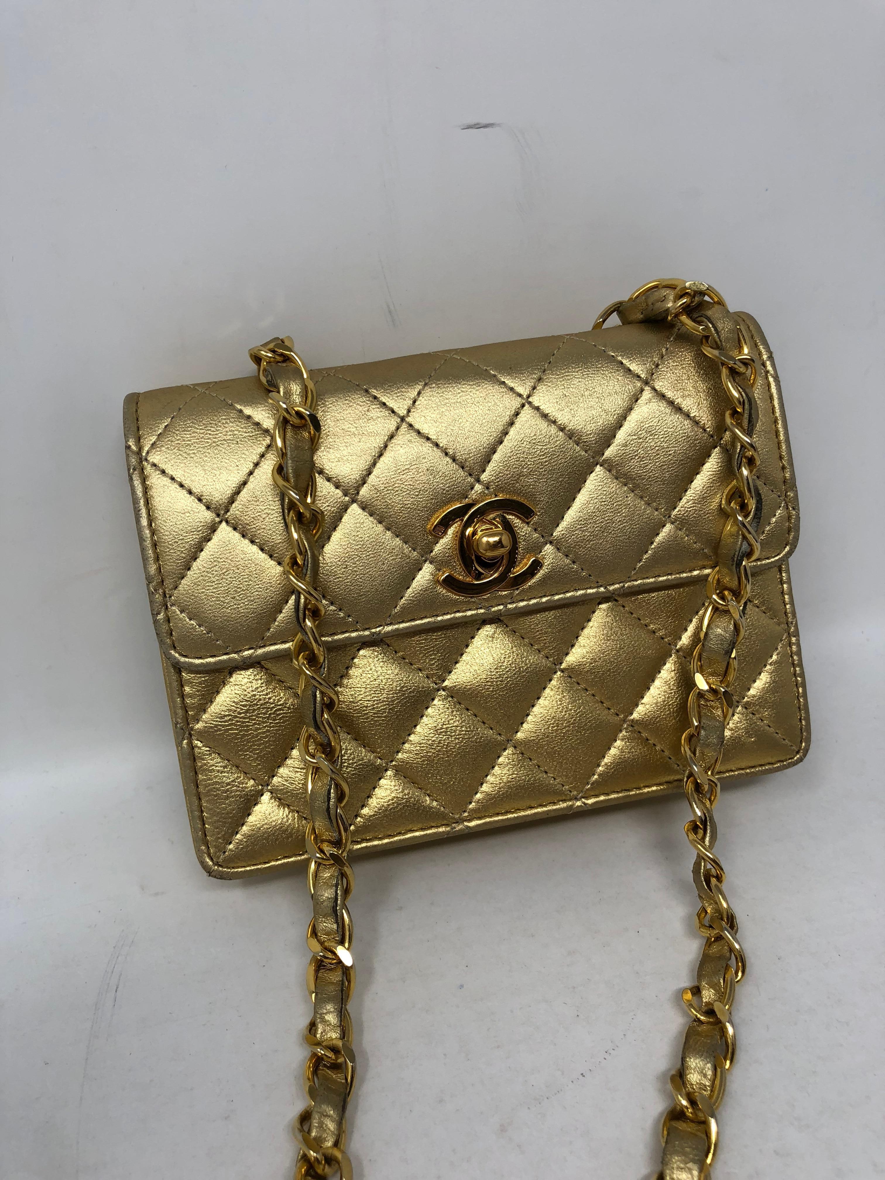 Chanel Gold Metallic Leather Evening Bag. Mini size square Chanel. Vintage and in good pre-owned condition. Guaranteed authentic. 