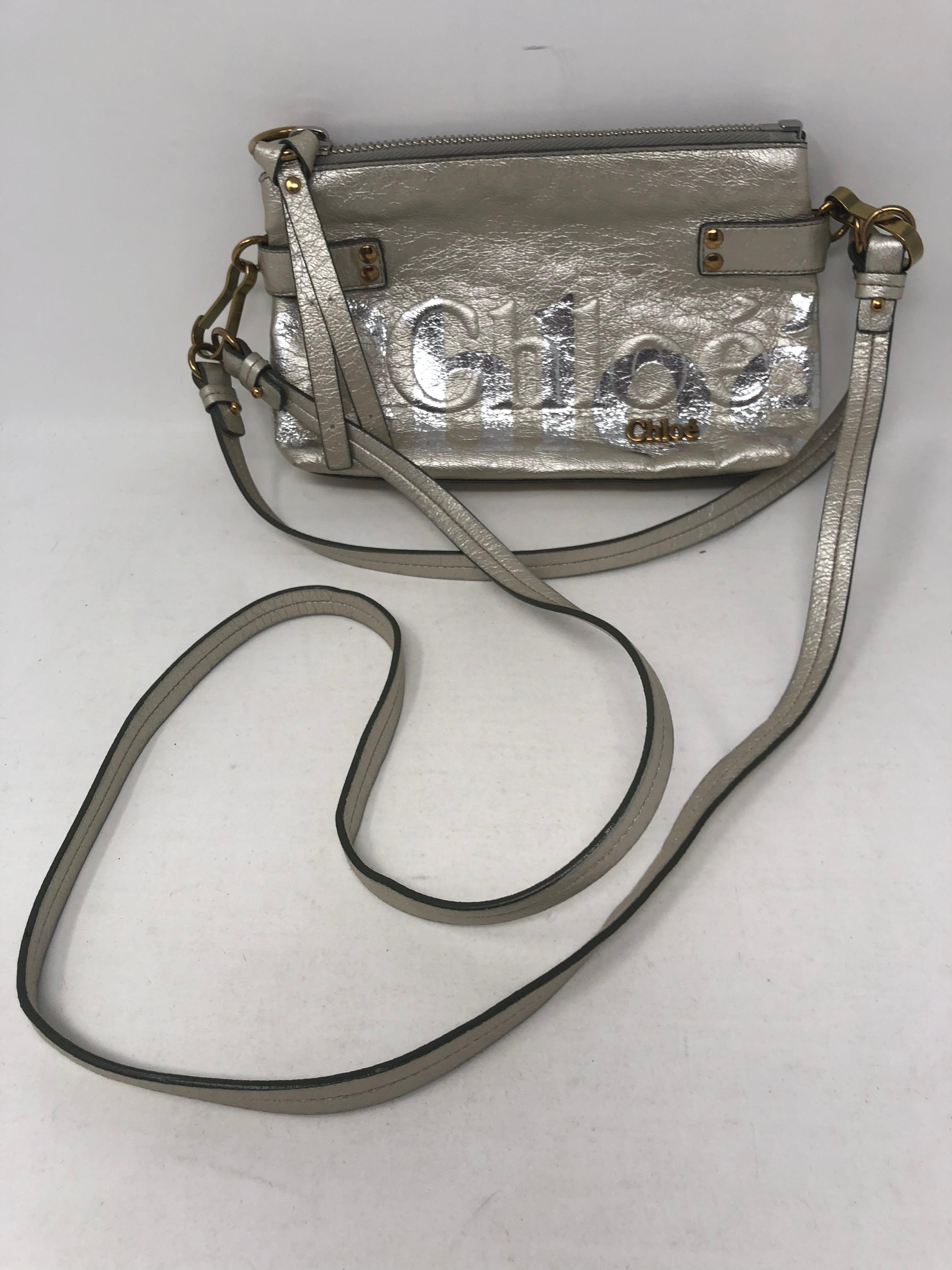 Chloe Silver Leather Crossbody. Removable long strap, can be worn as a shoulder bag or clutch. Like new condition. Silver metallic color. 
