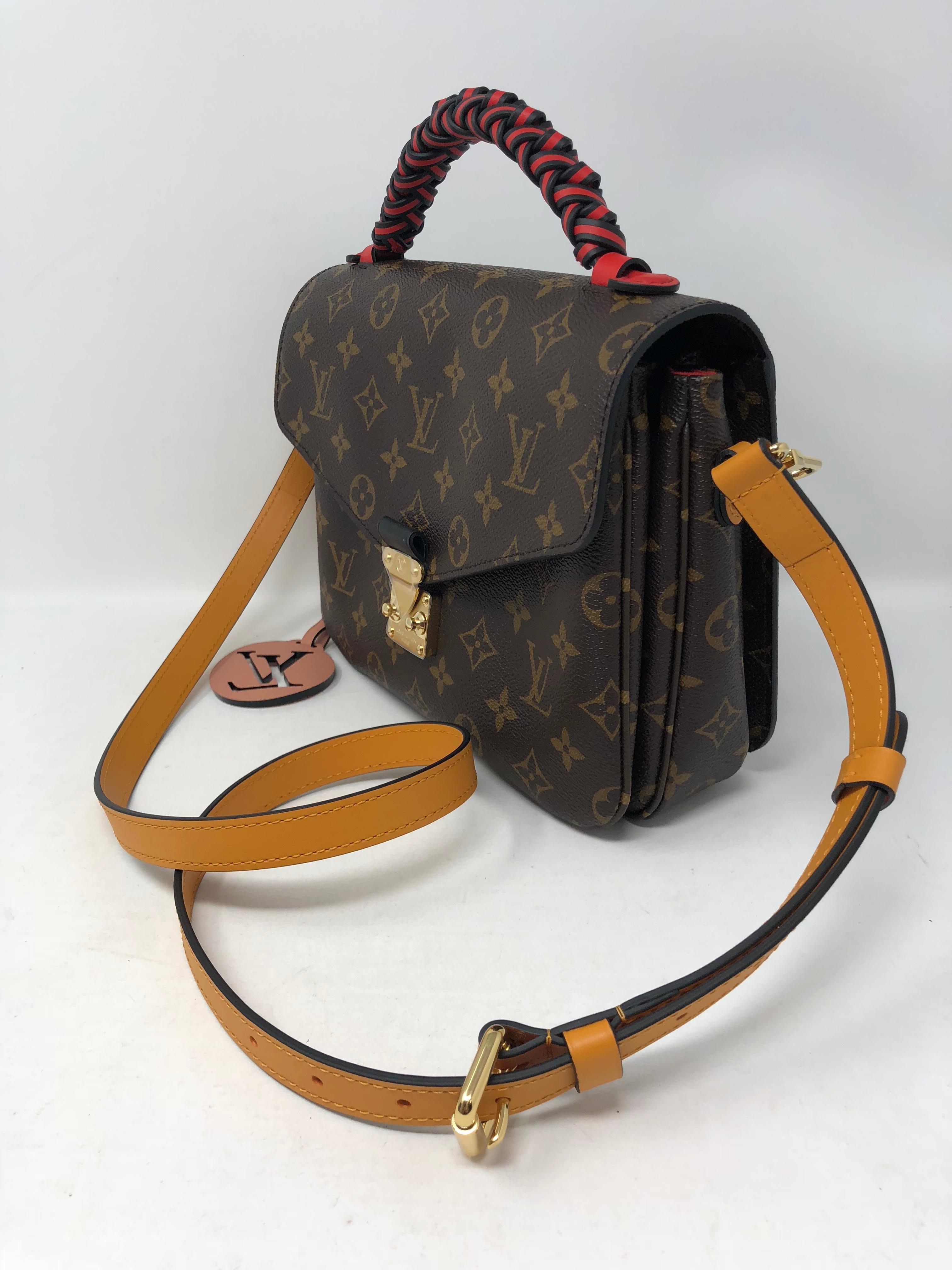 Louis Vuitton Pochette Metis Limited Edition Braided Handle coated with red and brown leather. Beautiful design. Never used and hard to get. Strap is detachable. Comes with full set. Original box and dust cover. Guaranteed authentic. 