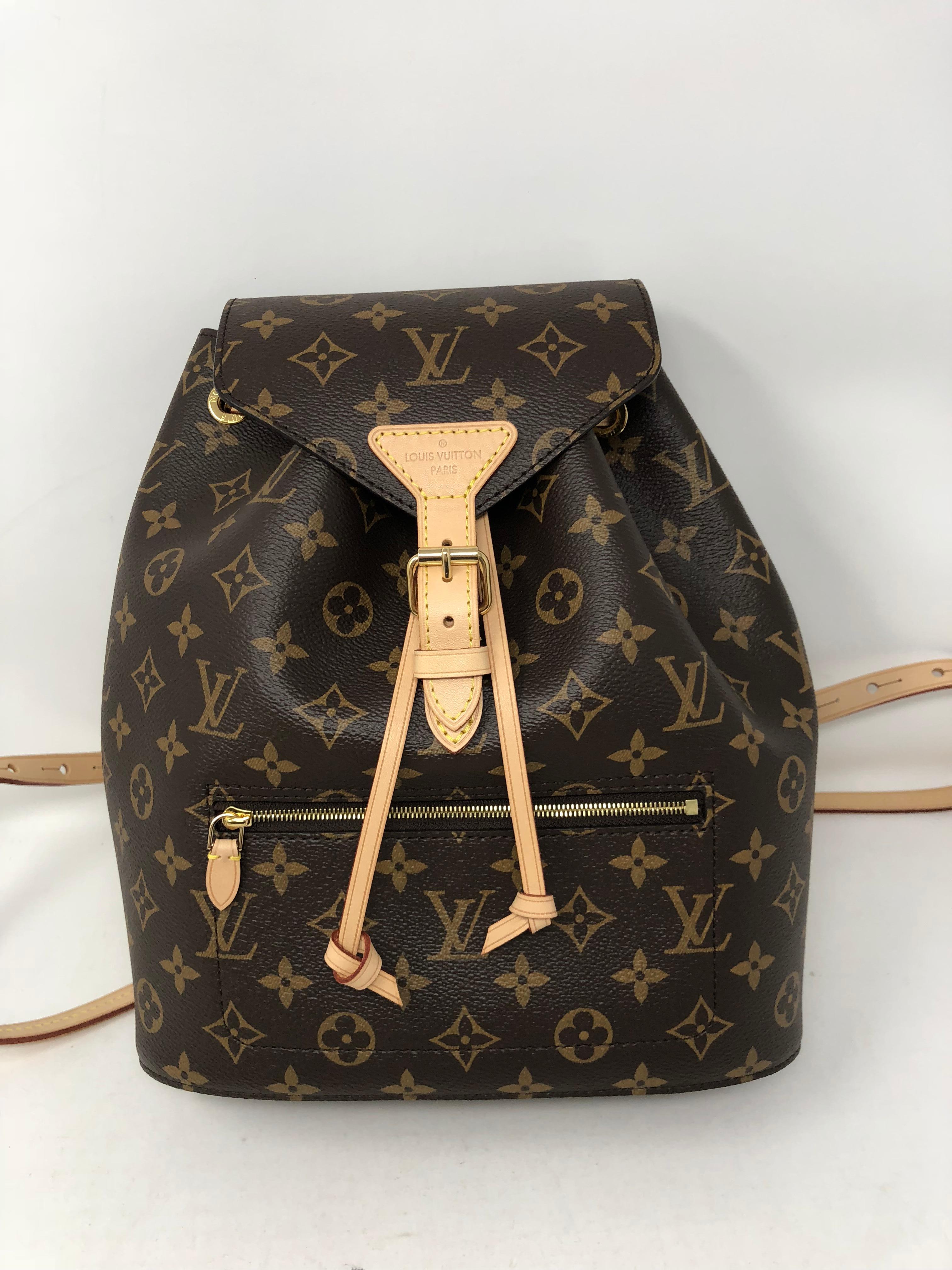 Louis Vuitton Monogram Montsouri Backpack. Newest version by LV. Brand new and hard to get. Never worn backpack comes with full set. Dust cover and box included. Guaranteed authentic. 