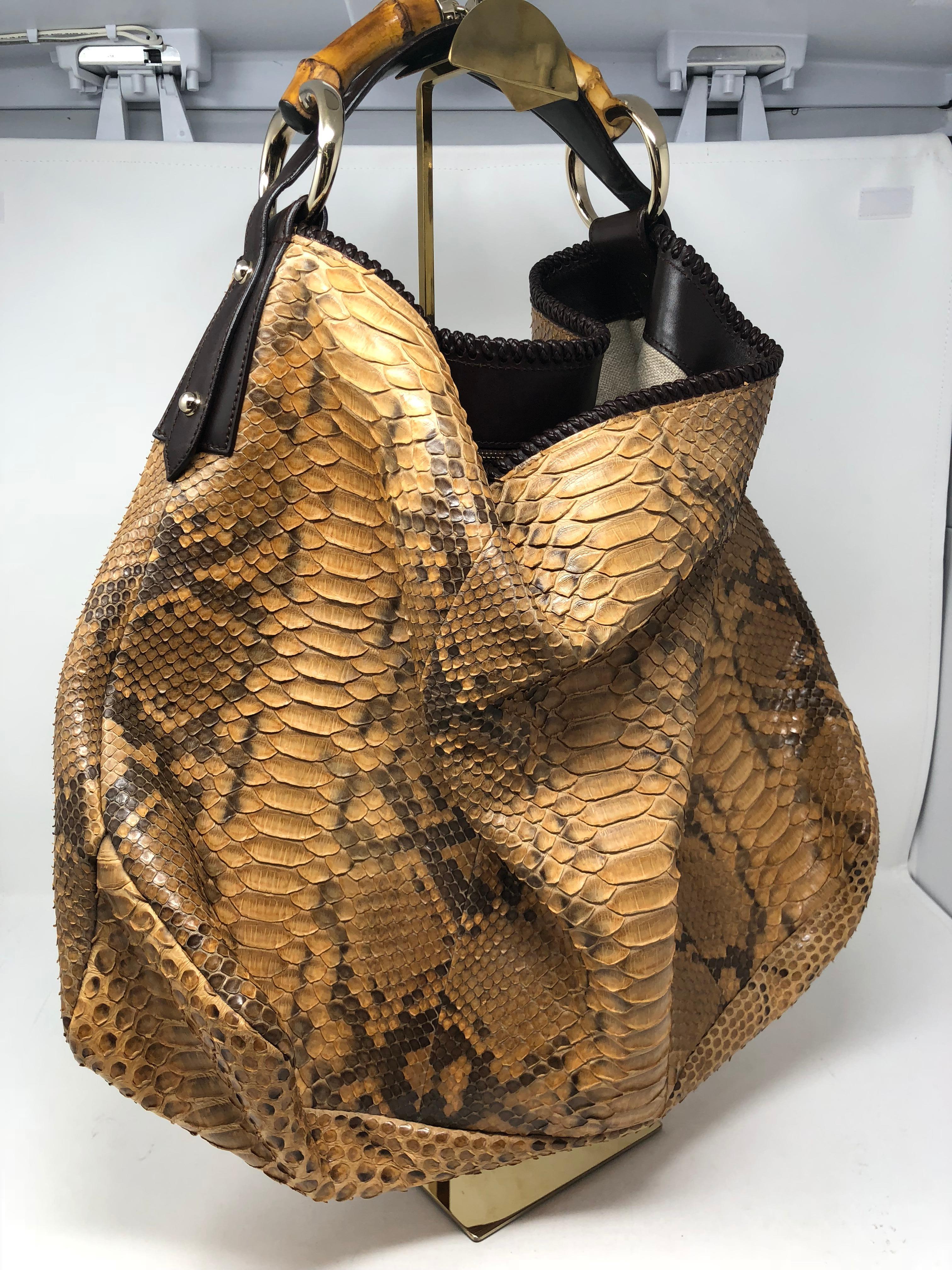Gucci Python Hobo Bag. Rare Python Gucci with bamboo handle. Mint condition. Hardly any wear and clean inside. Collector's piece. Guaranteed authentic. 