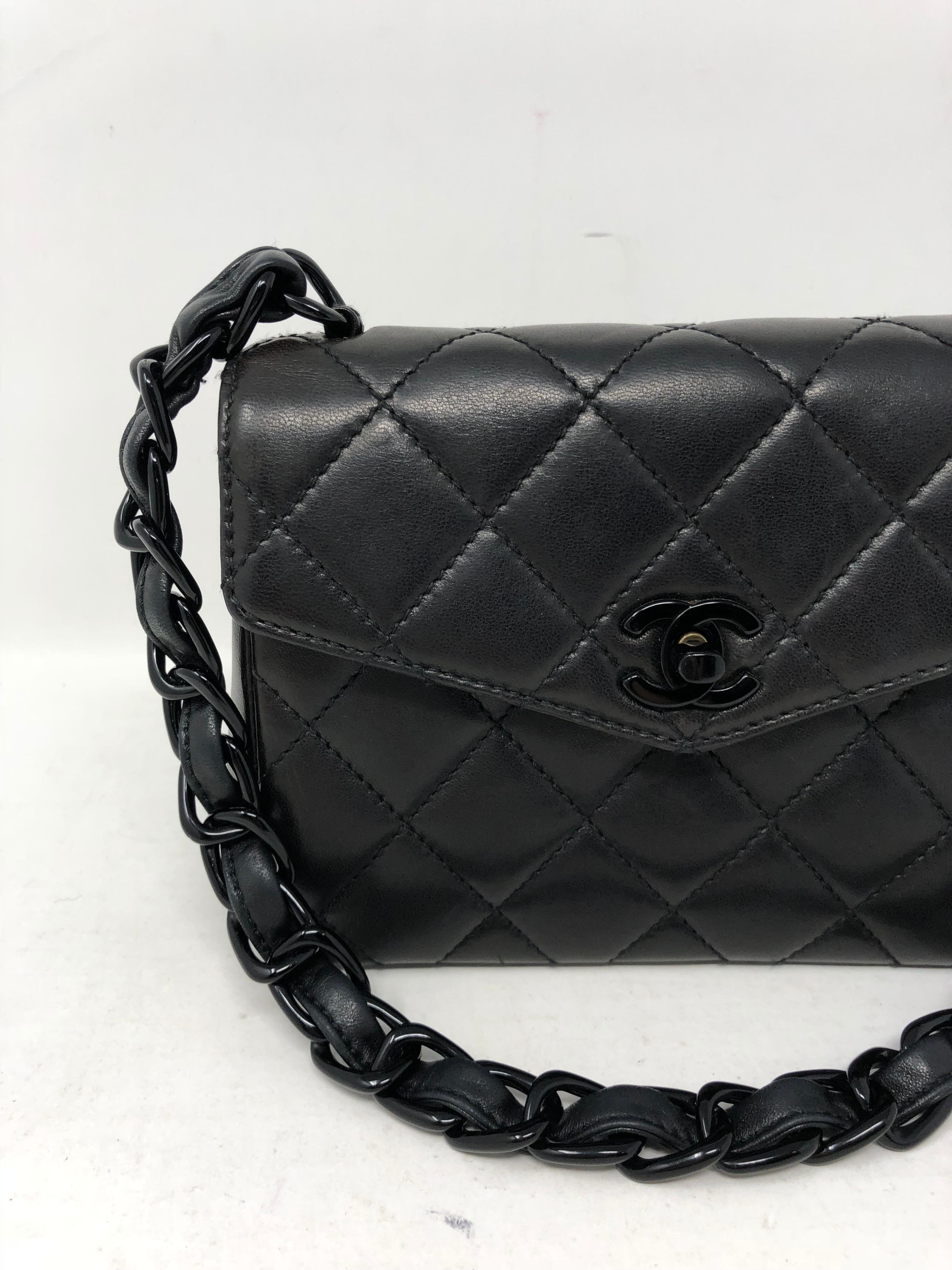 Chanel So Black Mini Bag. Lambskin leather with black hardware and short strap with woven black plastic chain. Mini size perfect for going out. Mint condition and rare collector's piece. Guaranteed authentic. 