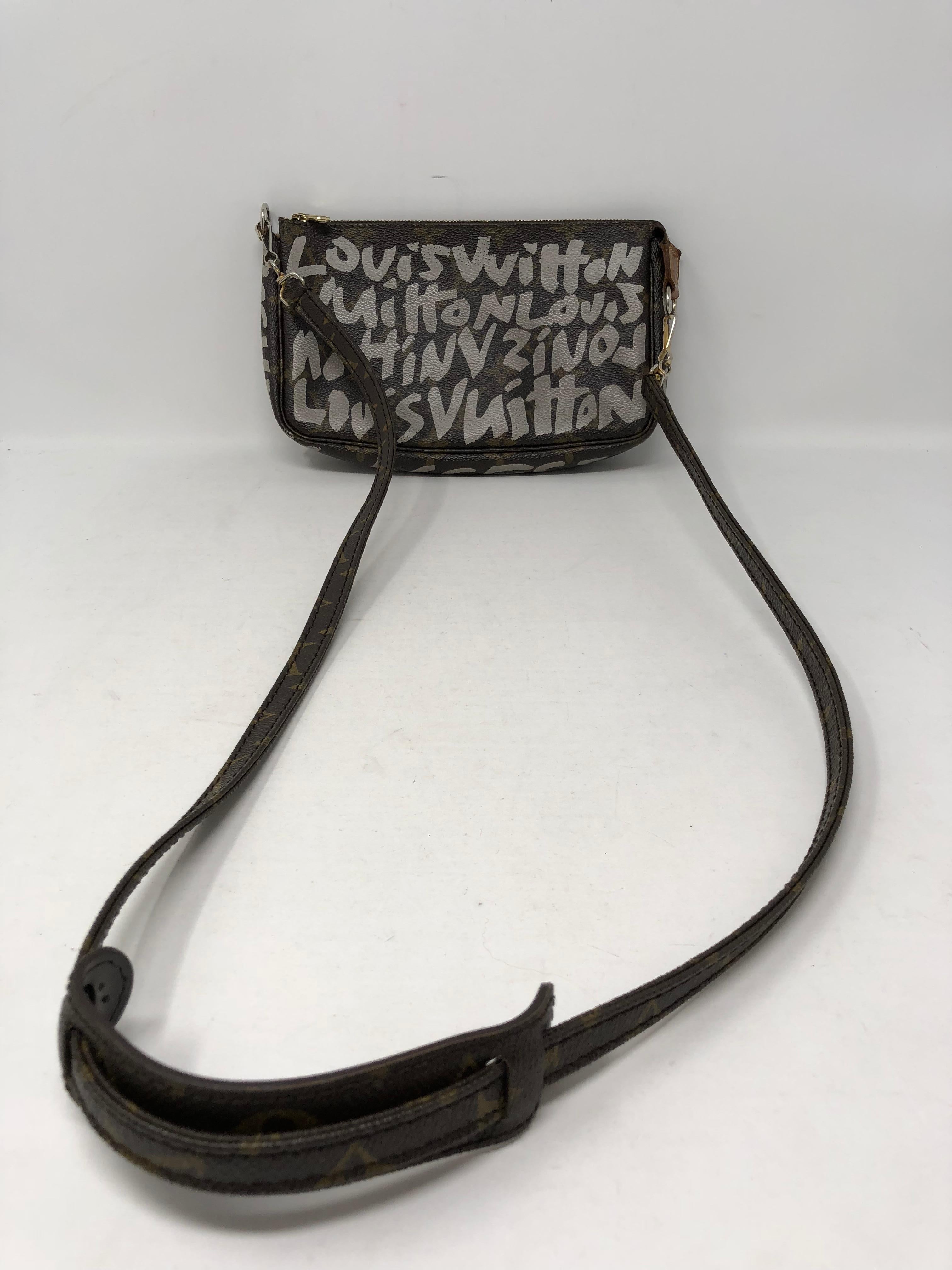 Louis Vuitton Stephen Sprouse white Graffiti pochette with strap. Strap is detachable and makes the bag into a clutch or can be worn as a crossbody. Rare Stephen Sprouse design. Guaranteed authentic. 