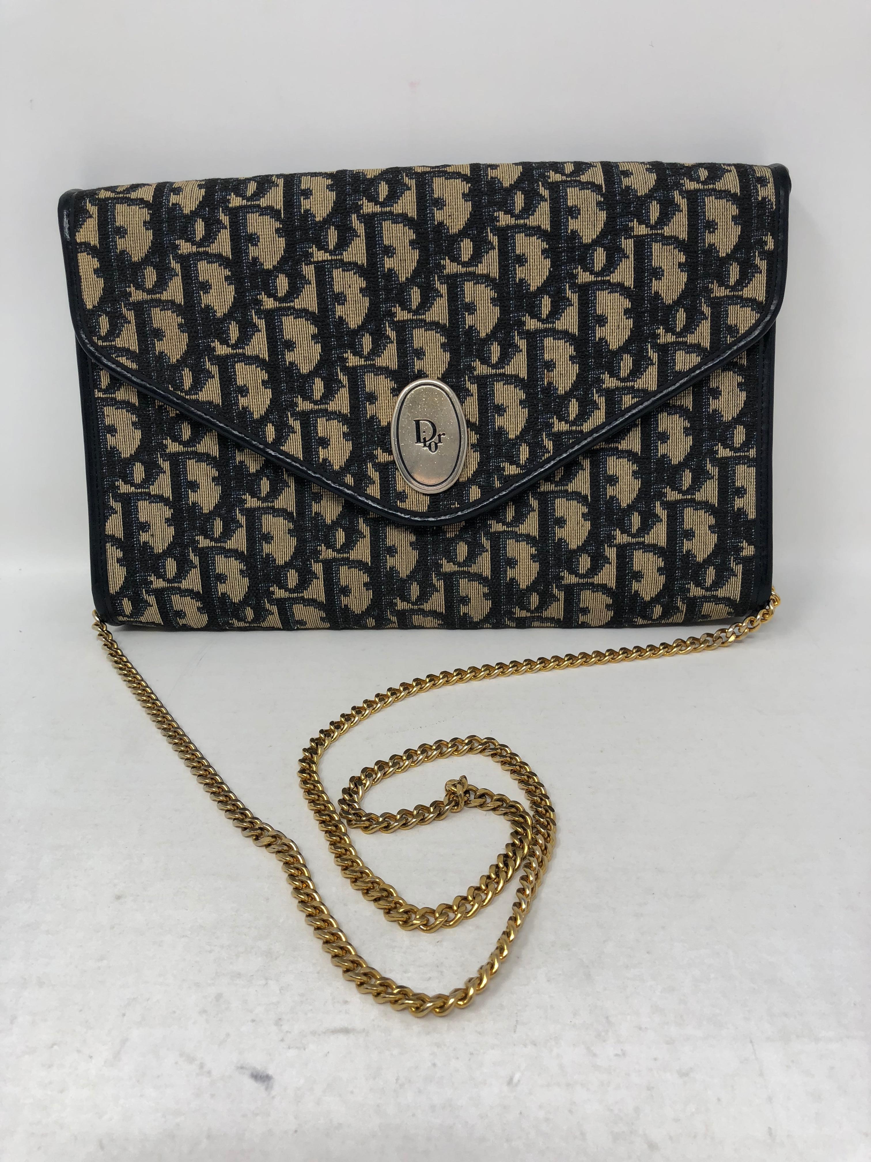 Dior Clutch/ Crossbody in monogram navy with leather trim. Gold chain. Vintage and highly collected Dior. Good condition. Guaranteed authentic. 
