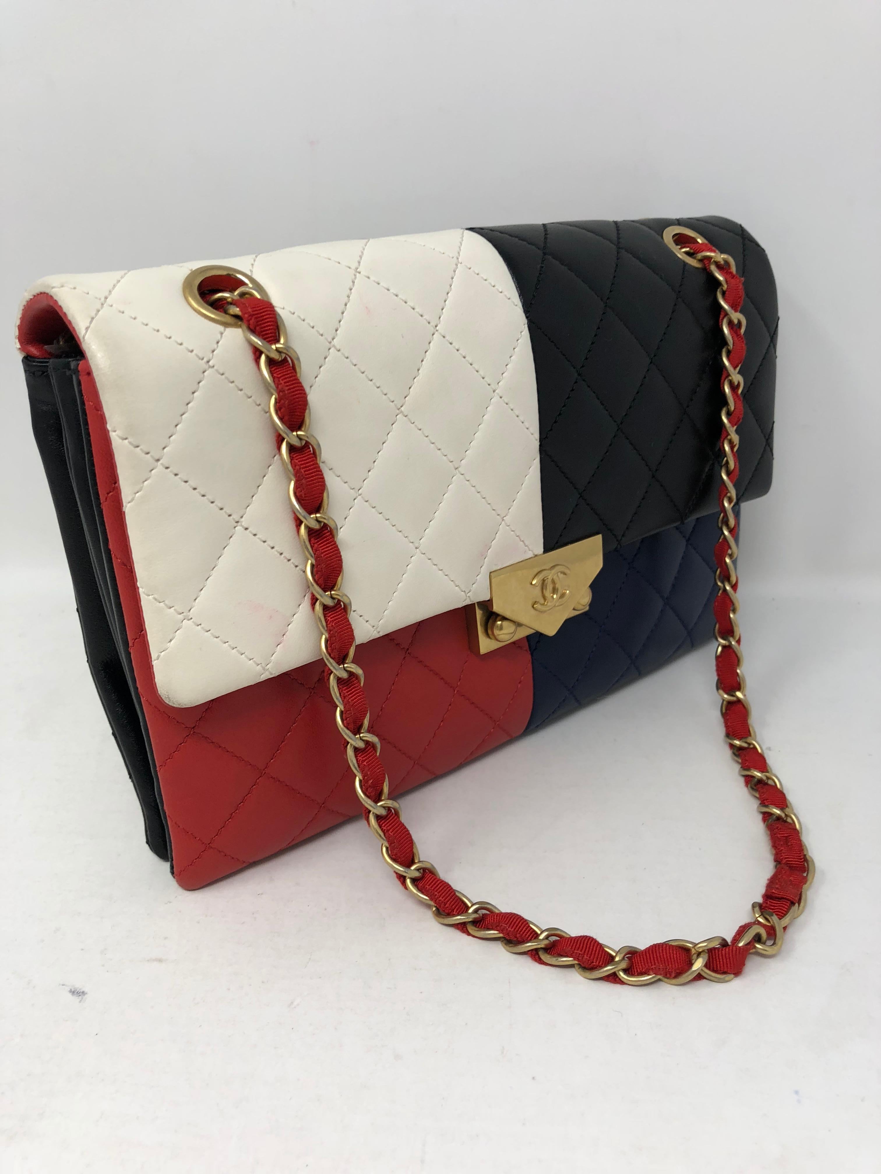 Chanel Multi-Color Block Clutch/ Bag. Can be worn longer or doubled. Envelope clutch size. Beautiful lambskin leather in red, white, black, and navy. Unique piece by Chanel. Authenticity card included with dust cover. Guaranteed authentic. 