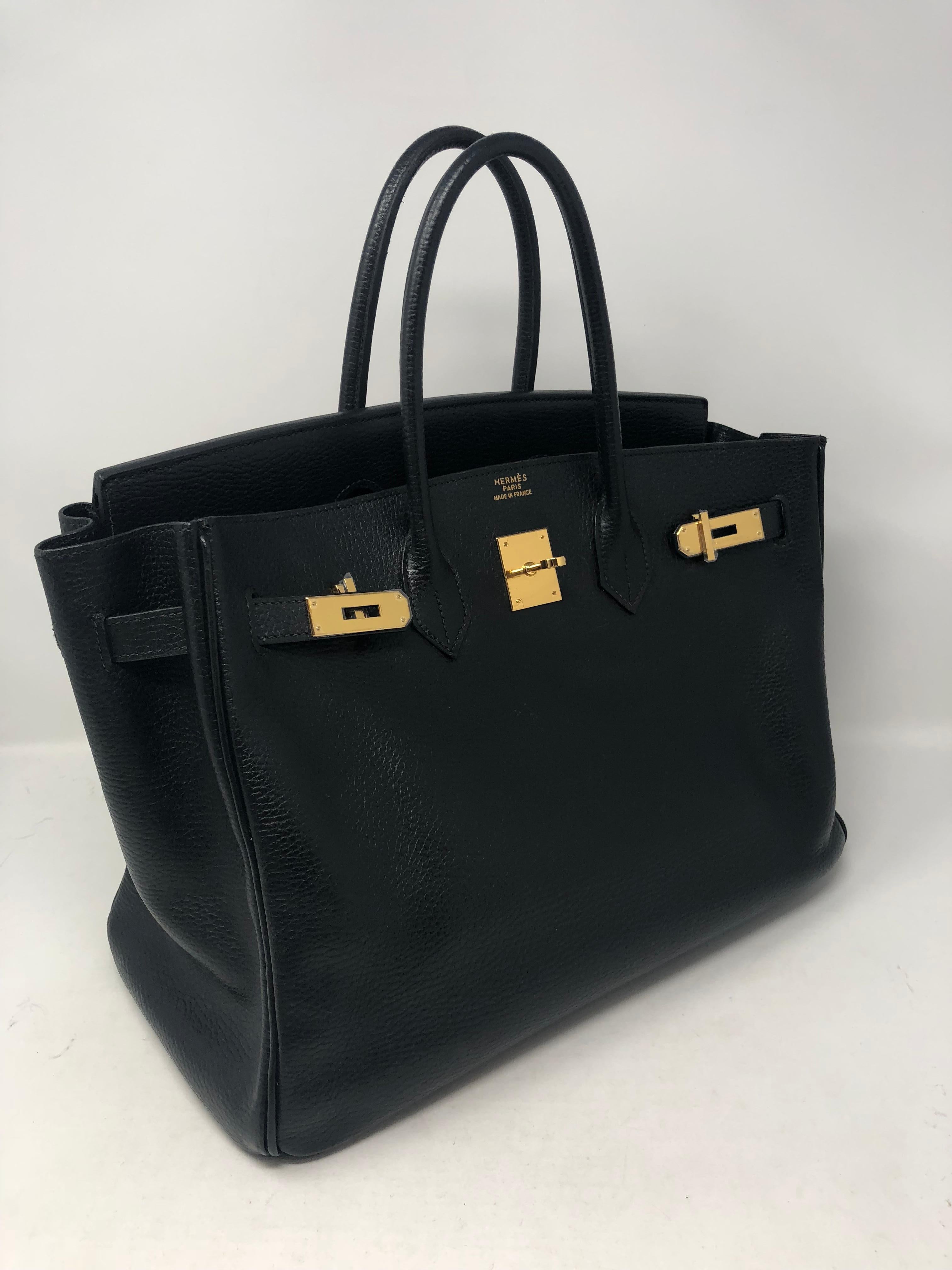 Hermes Black Birkin 35 Ardennes leather with gold hardware. Fully restored at Hermes for spa treatment and new closure with new gold tabs. Receipt from Hermes for the new plates and closure included with the bag. Beautiful black leather with some