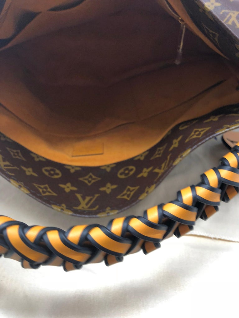 louis vuitton purse braided handle