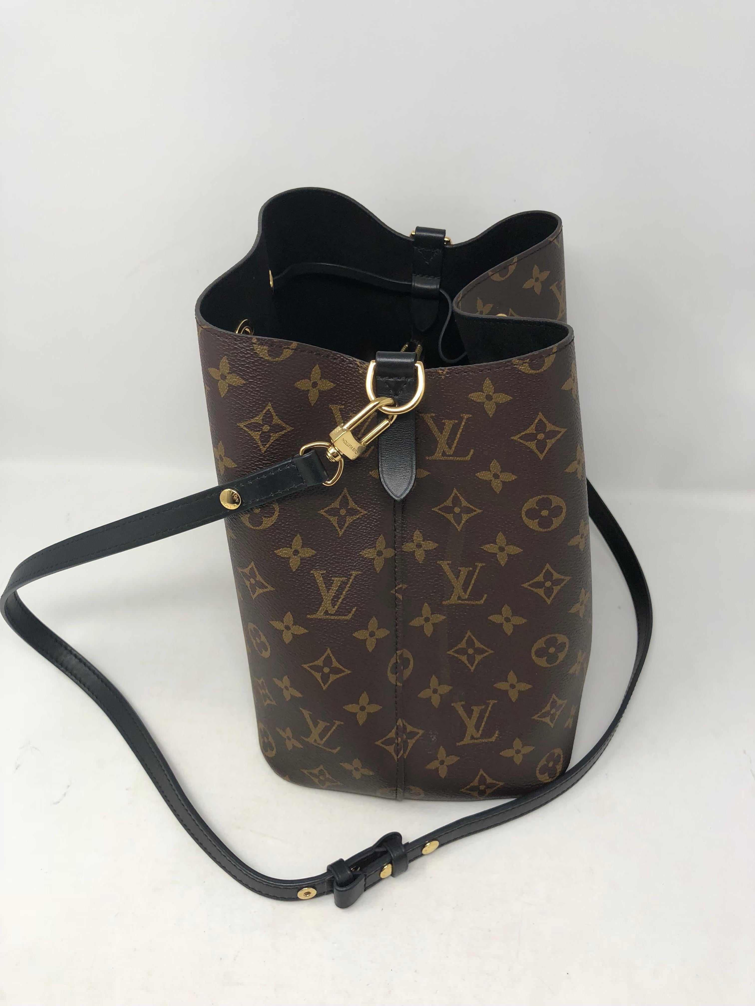 Louis Vuitton Neonoe Black Bag. Classic bucket style shoulder bag is made of coated monogram canvas with black leather details. Black microfiber interior and a nice roomy space to keep all your essentials. Strap is also adjustable and can be worn