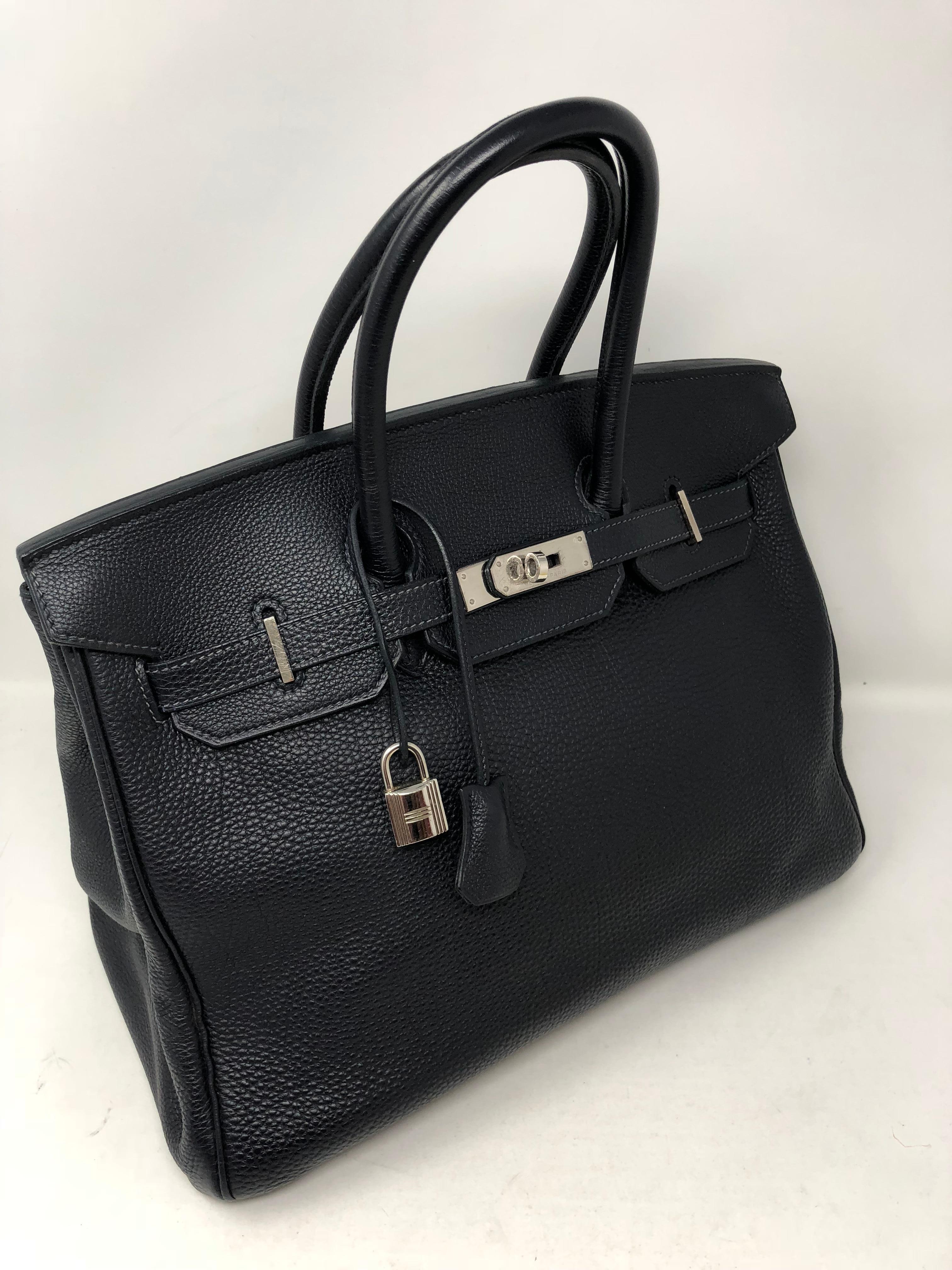 Hermes Black Birkin 35 togo leather with palladium hardware. Good condition. Bag includes dust cover, clochette, lock and keys. Guaranteed authentic. 