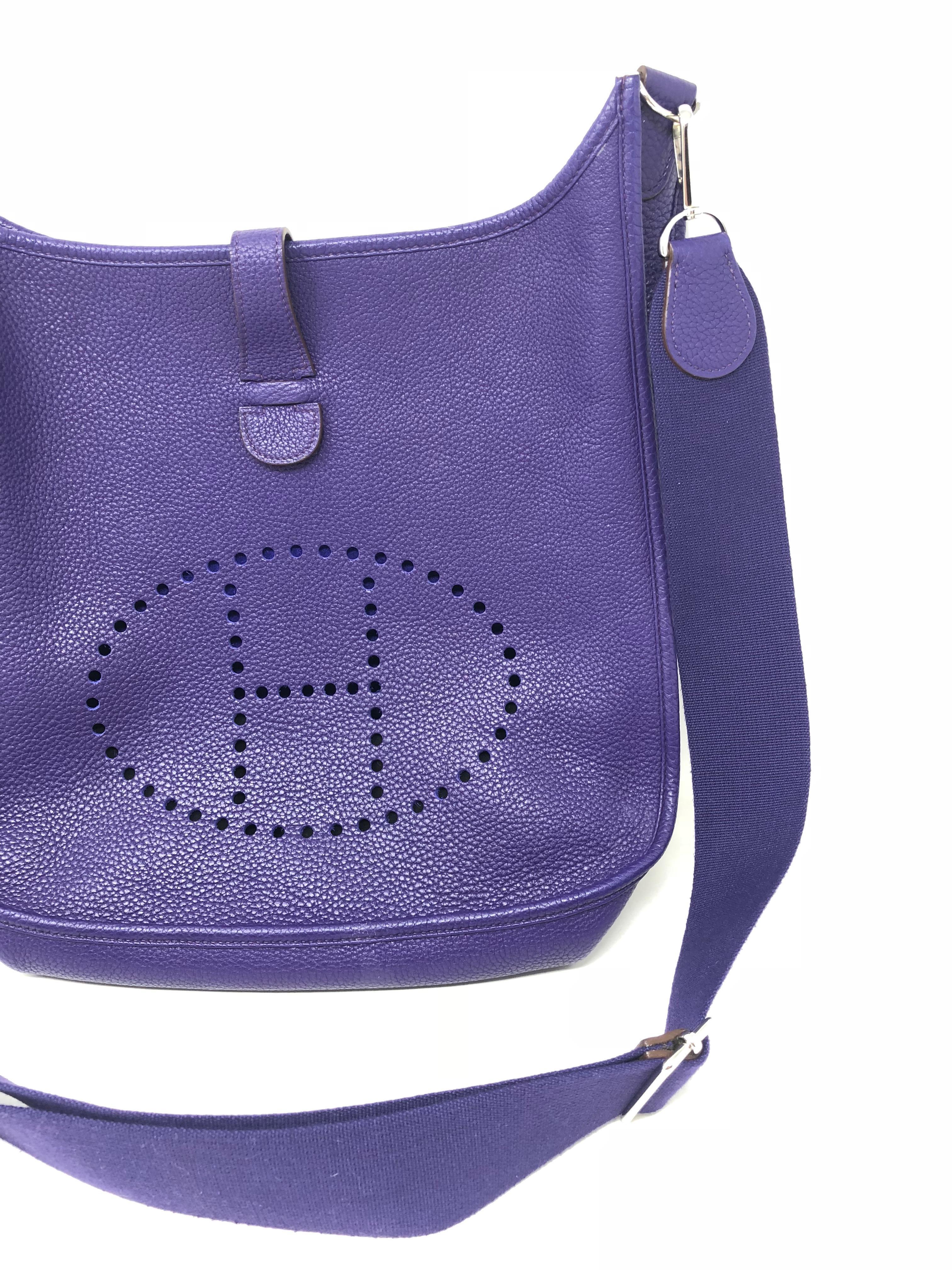 Hermes Evelyne GM Bag in Purple leather. Togo leather in a rare purple color. Mint condition. Newest series with adjustable strap. Most wanted and hardest to find color. Guaranteed authentic. 