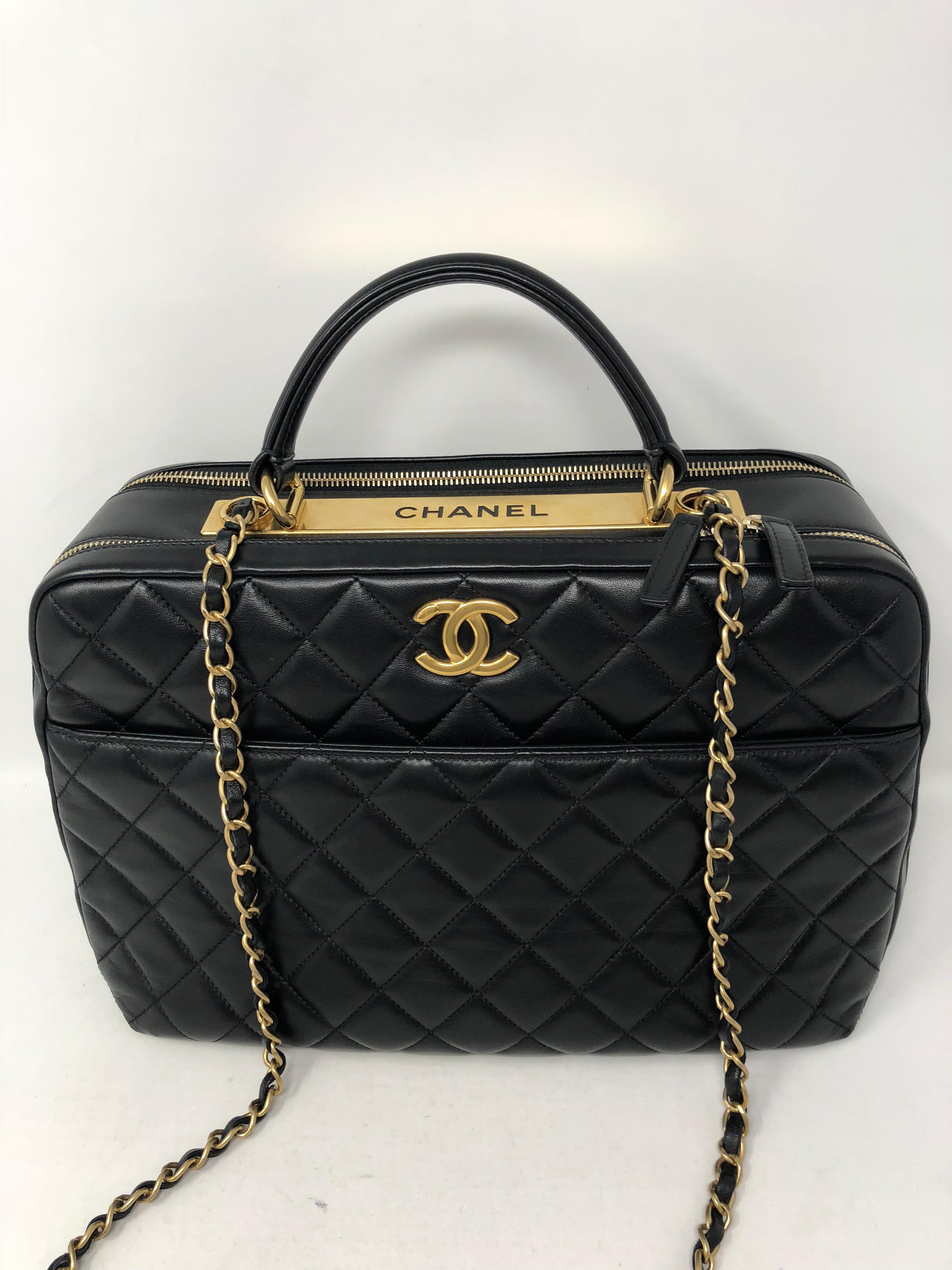 Chanel Black Trendy CC Bowling Bag with gold hardware. Quilted lambskin leather in large size bag with gold Chanel plate on top with CC on front. Has 2 size straps to be worn multiple ways. Never used, like new condition. Unique style and a lot of