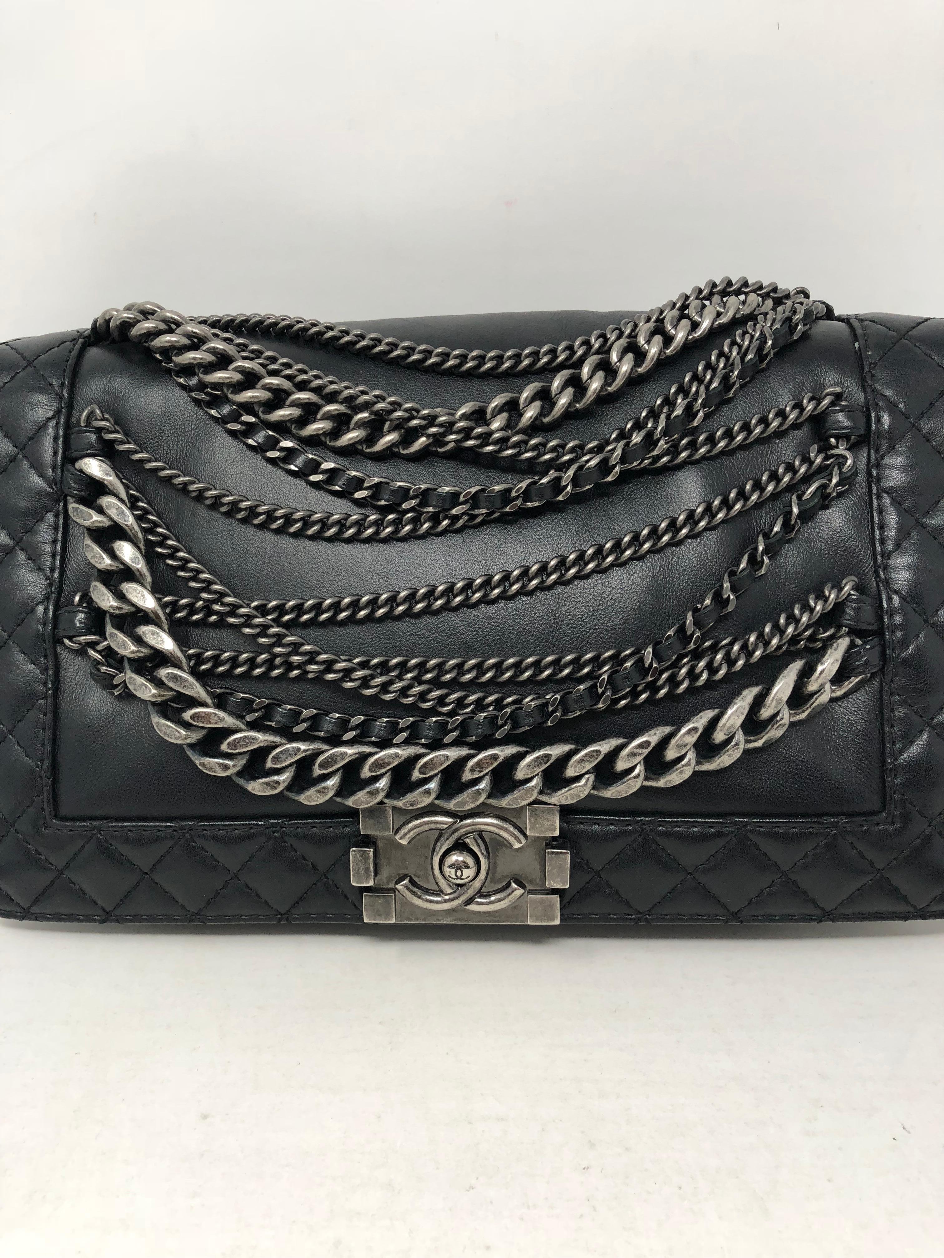 Chanel Black Chains Around Boy Bag with antique silver hardware and chains. Rare and hard to find. A great addition to your Chanel collection. Can be worn two ways. Comes with authenticity card and matching serial number inside bag. Good condition.