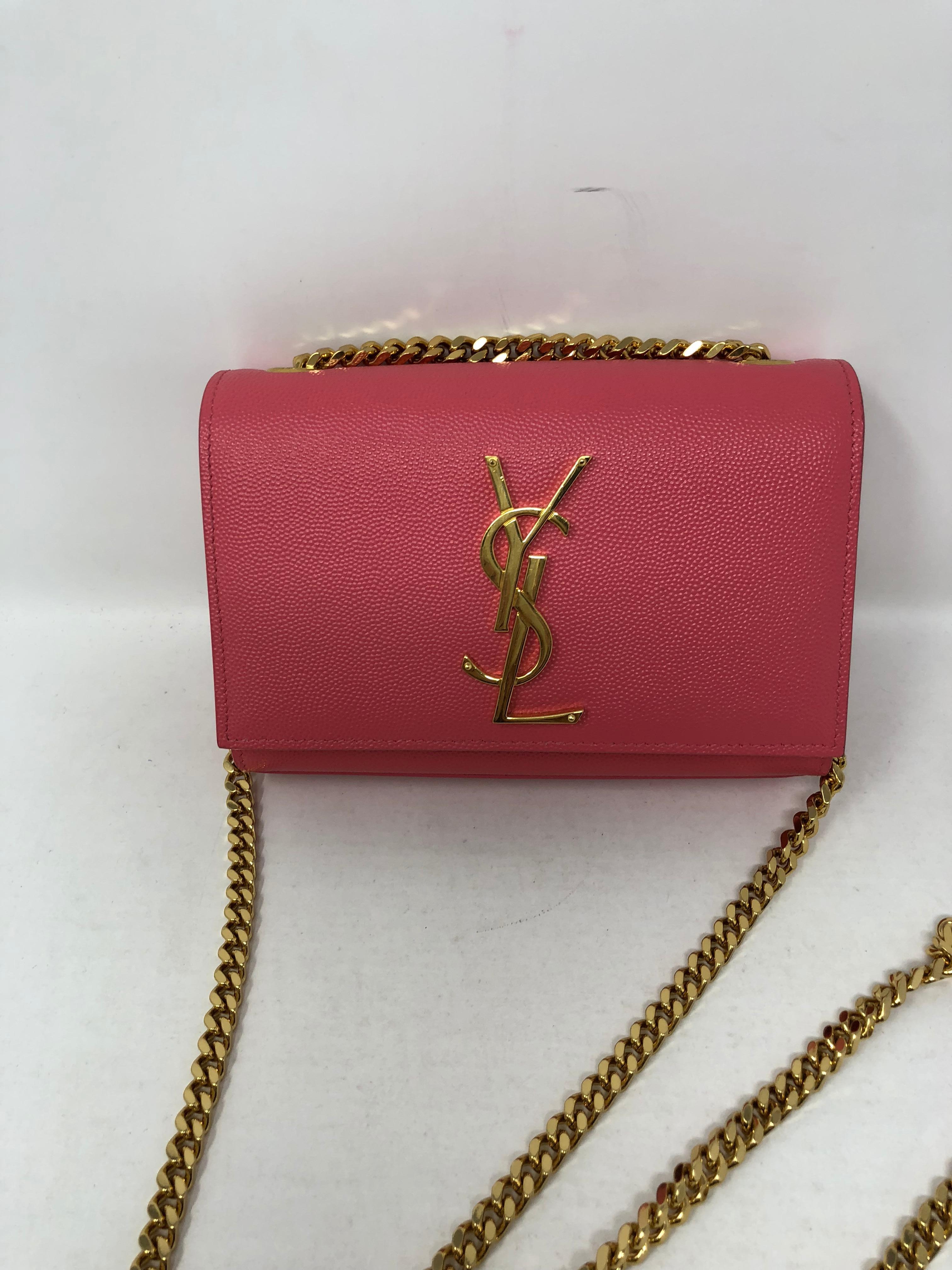 YSL Mini Pink Crossbody with gold signature and chain. Like new and hard to find bag. Can be worn as a clutch and doubled too. The perfect mini bag for evening or any special event. Guaranteed authentic. 