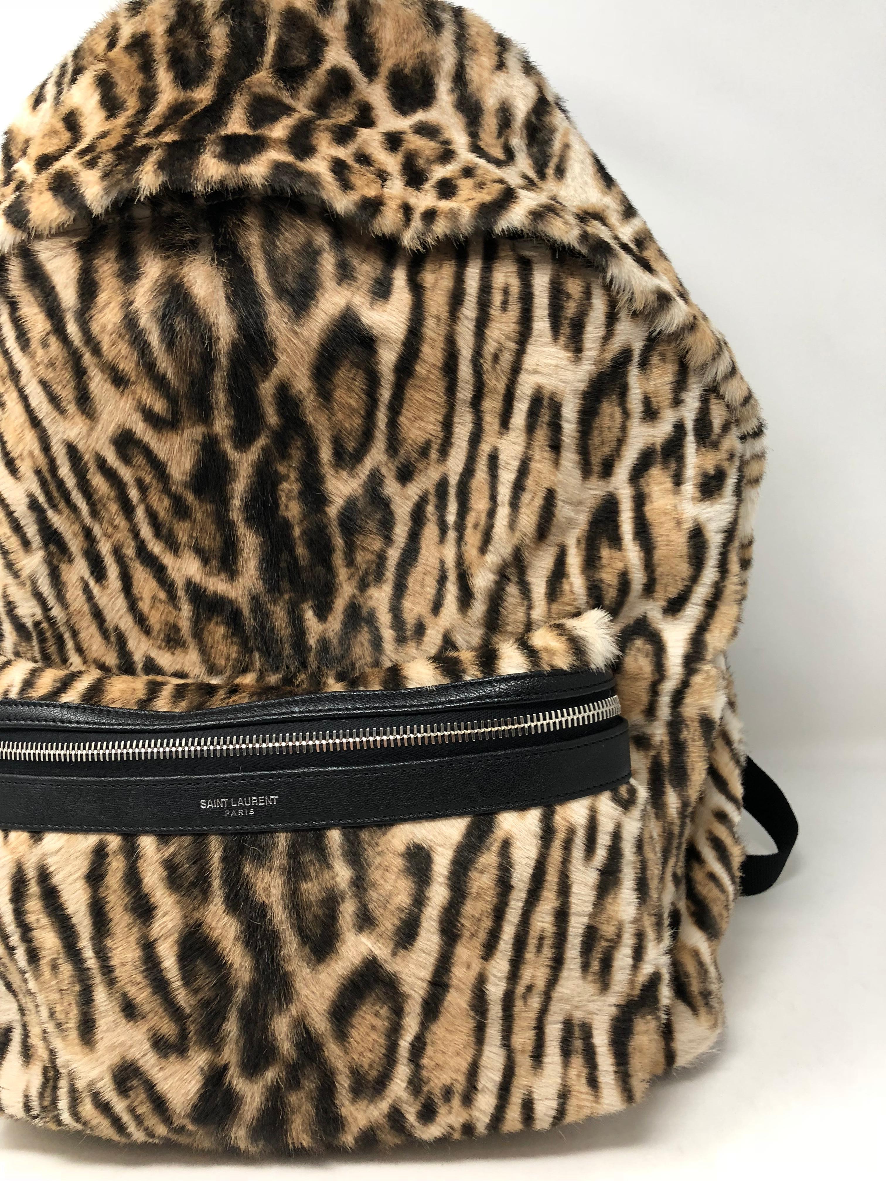 Yves Saint Laurent Big backpack in leopard style fur. Just purchased this year. Retail with tax over $3500. Roomy size backpack with leopard print on fur. Like new condition. Used only on a few photoshoots. Clean interior. Includes original YSL dust