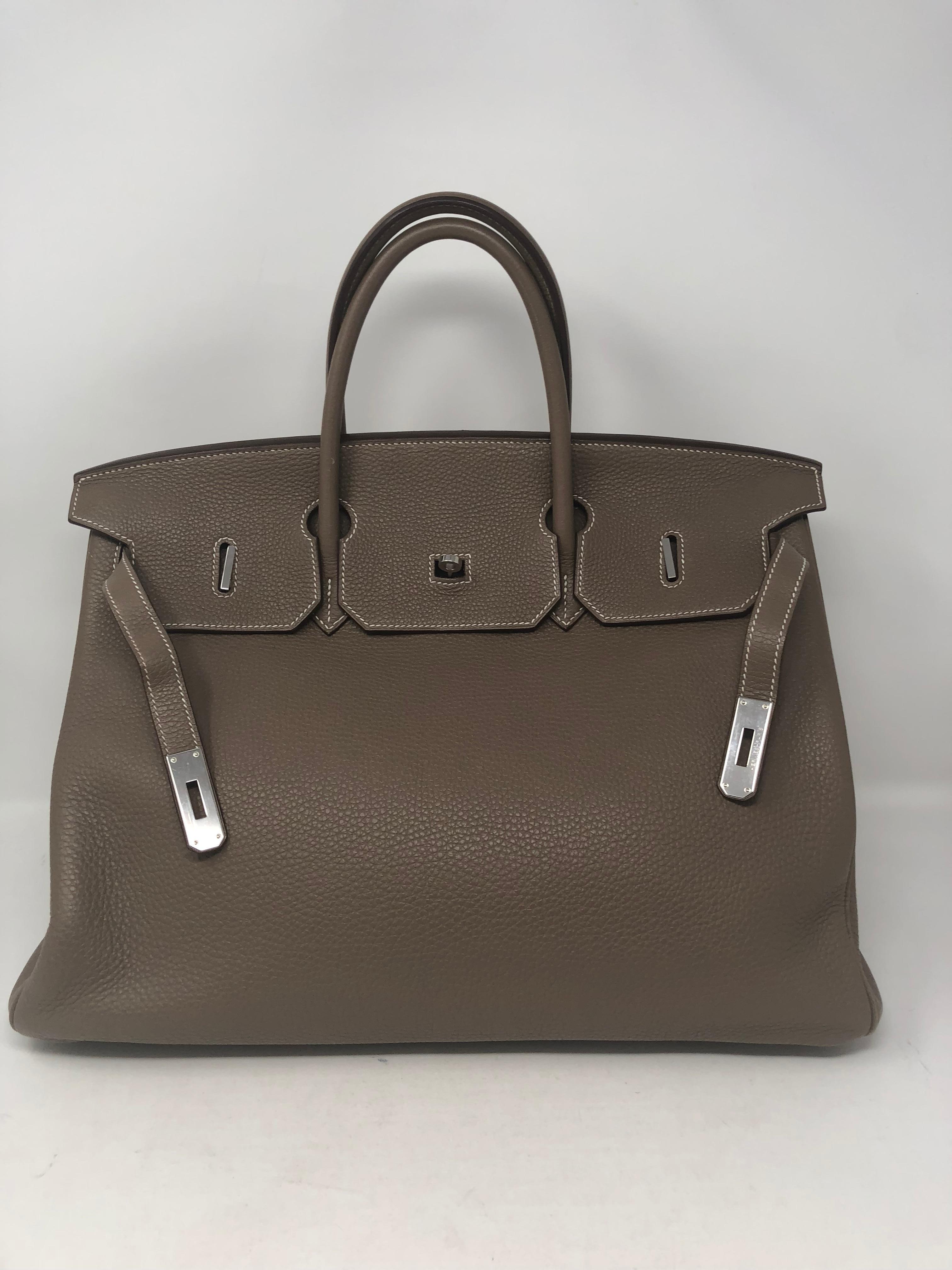 Hermes Birkin 40 Etoupe color in Togo leather. Palladium hardware. Beautiful gray/ tan etoupe color that is nuetral. Most wanted color and hard to find. Size 40 is great for travel and an everyday bag. Good condition. Clean interior. Togo leather is