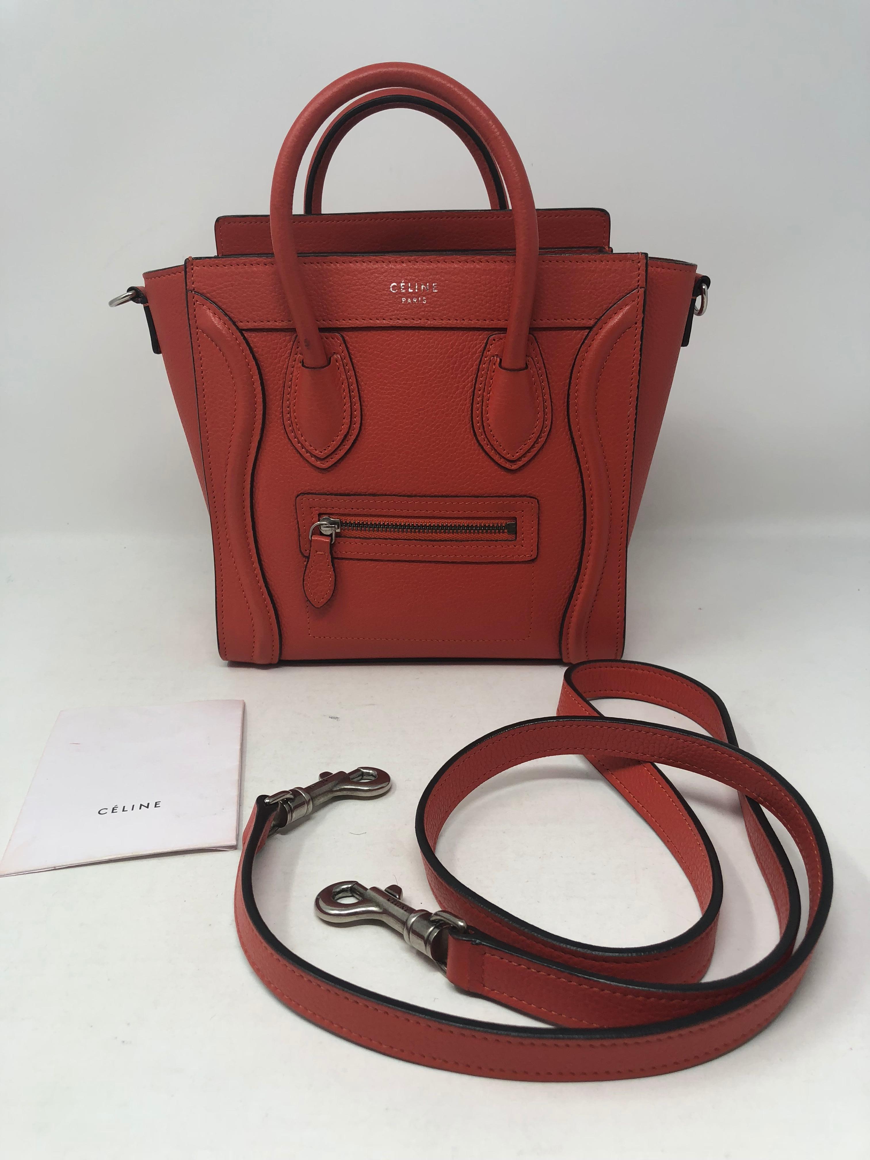 Celine Nano Orange Red color Crossbody. Mini size Celine bag with detachable strap. Drummed leather in good condition. Most wanted style by Celine. Silver hardware. Clean interior. Guaranteed authentic. 