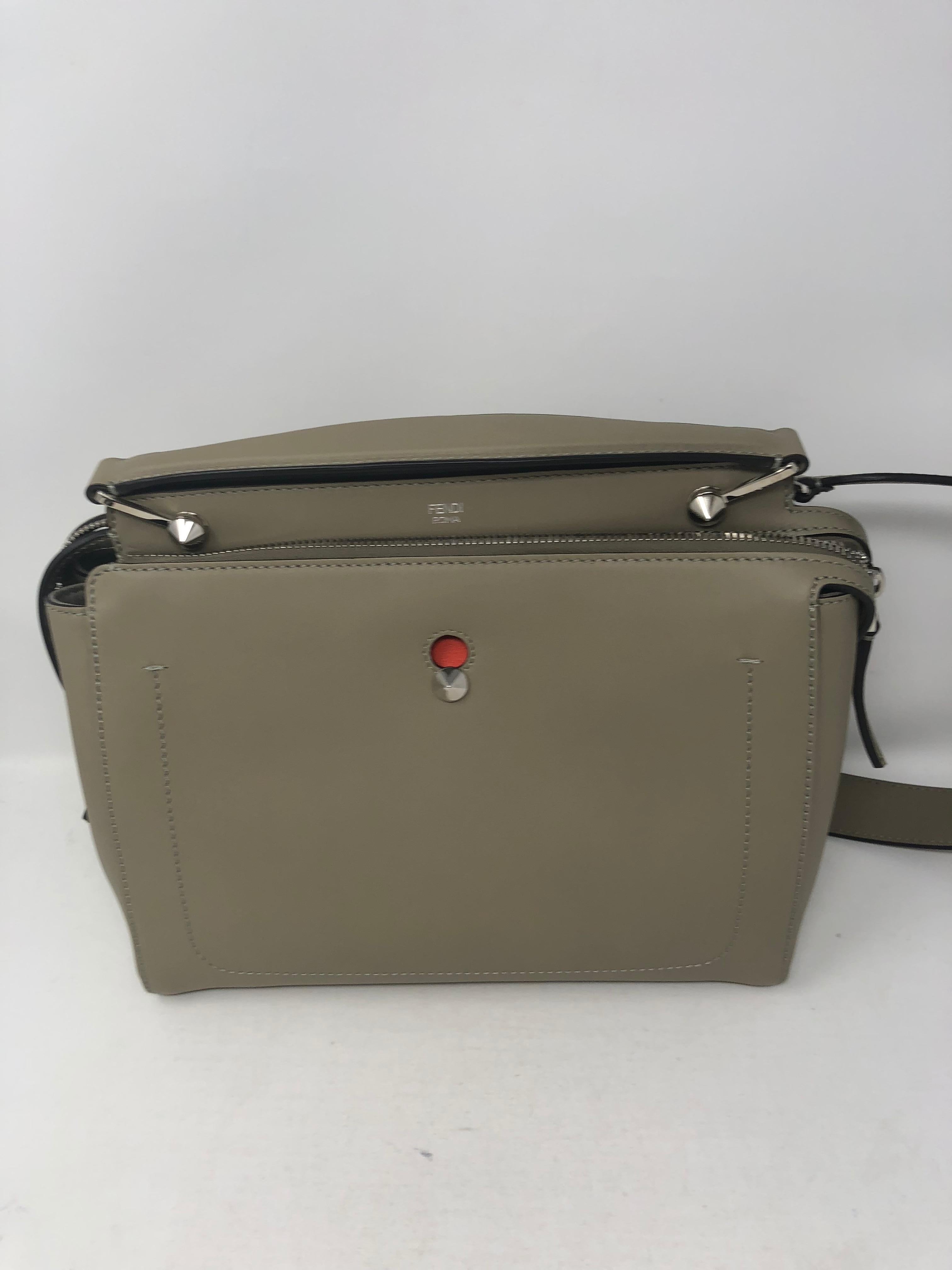 Fendi Dotcom Leather satchel in Dove Gray with red interior. Stunning bag in new condition. Never used. Great neutral color. Stap is detachable. Silver hardware. The inside pouch comes out too. Guaranteed authentic. 