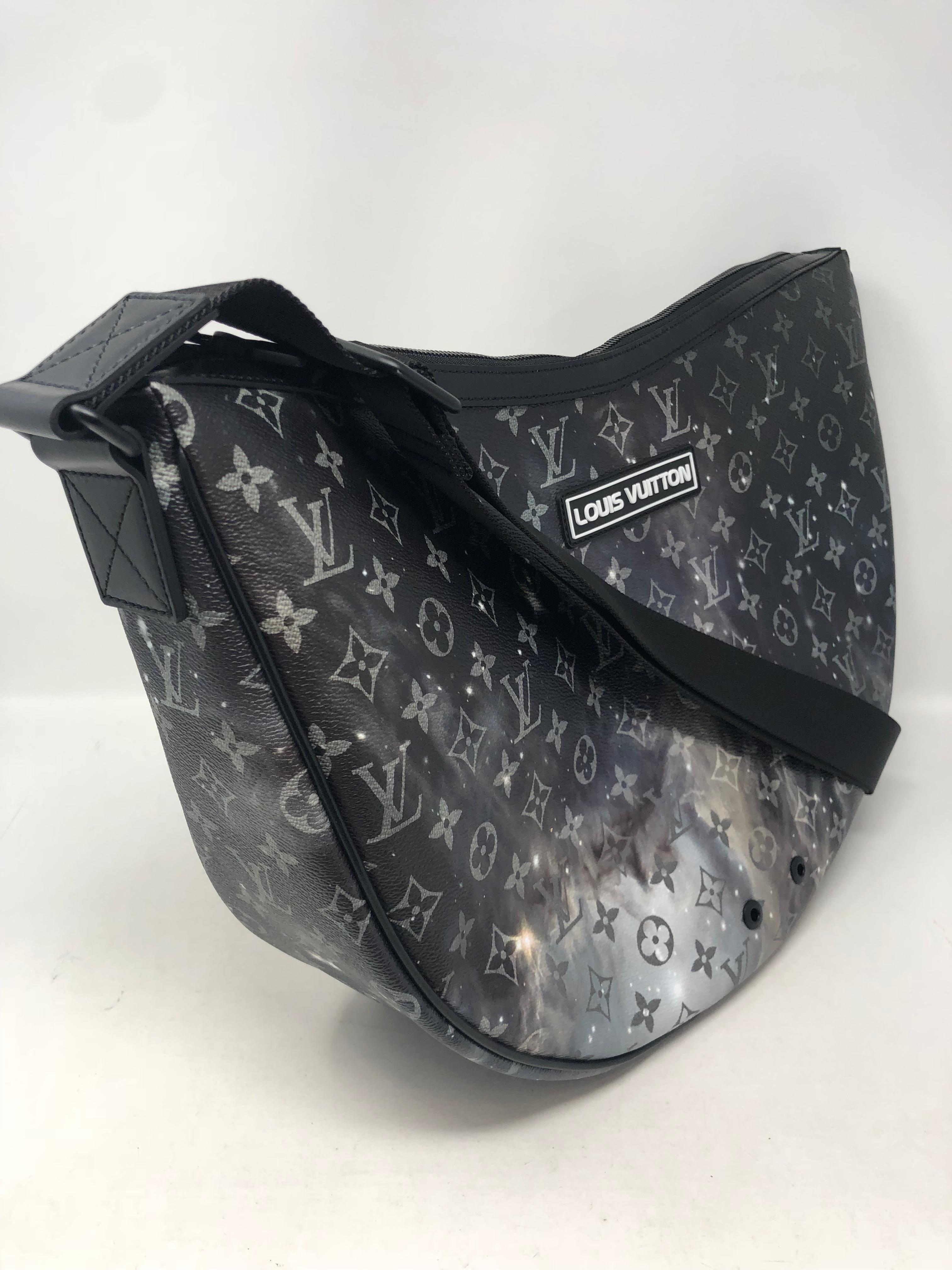 Louis Vuitton Galaxy Alpha Hobo bag can be adjusted to be worn as a crossbody too. This brand new and sold out at LV was inspired by Space. This Spring/Summer 2019 collection is very limited. The crescent moon shape of this bag is very different