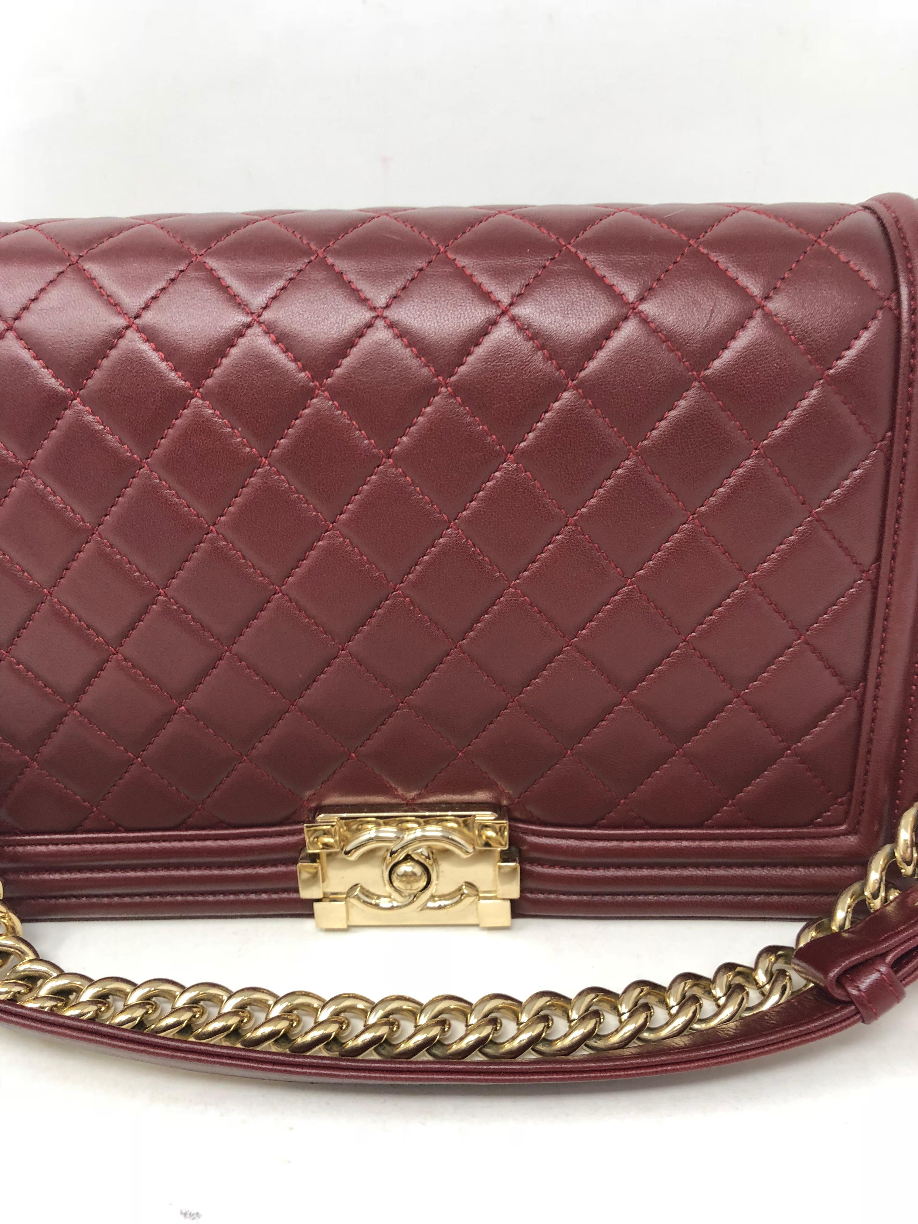 Chanel Burgundy Boy Bag with gold hardware. Great condition bag. Hardware and chain like new still very shiny gold. Lambskin smooth leather in good condition. Bag can be worn as a crossbody or shorter. Stunning and rare color. Boy Bags are classics.