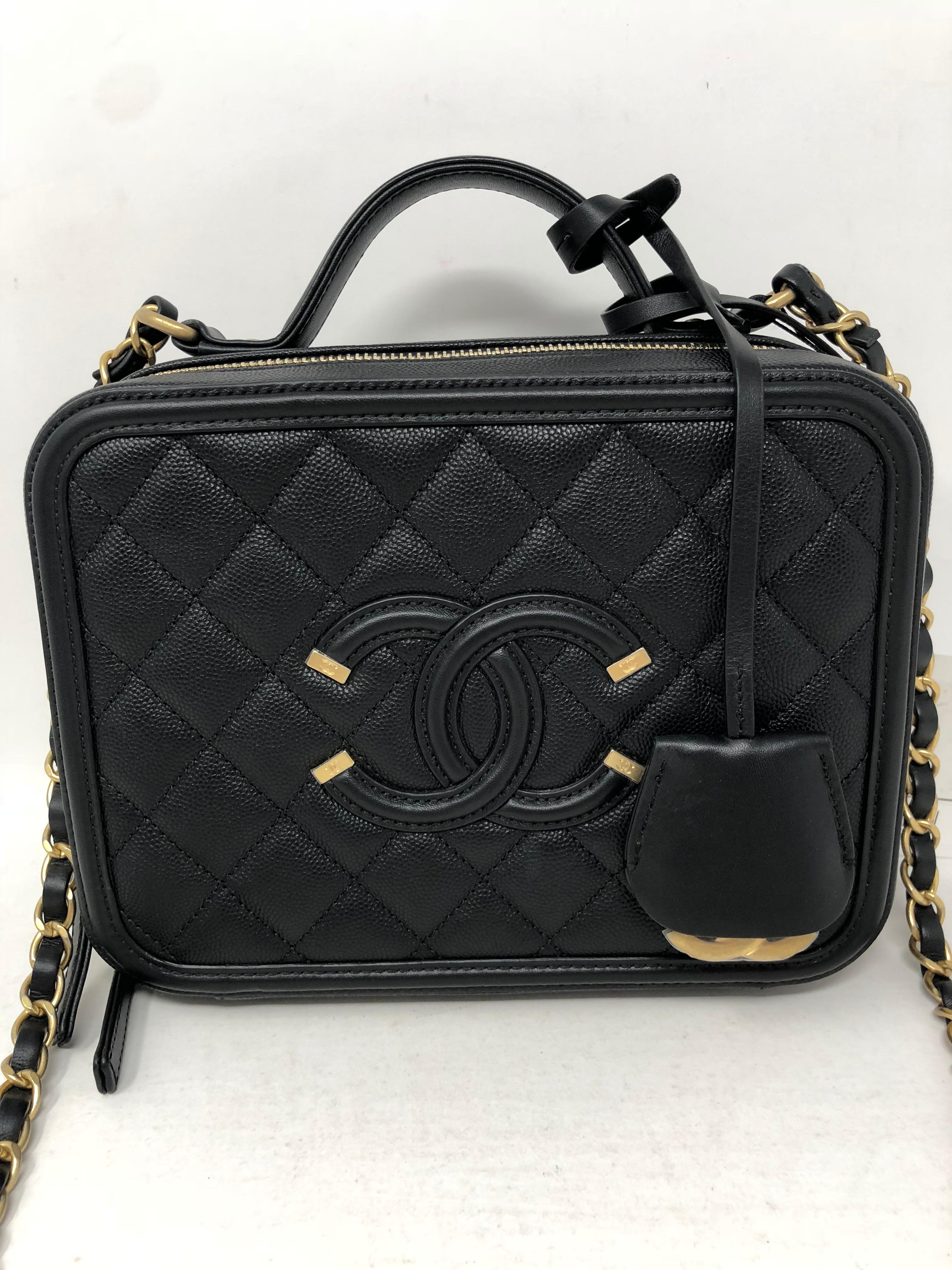 Chanel Vanity Case Bag. Brand new with original tag. The most sought after Chanel bag in black caviar leather. Comes with dust cover and box. Can be worn as a shoulder bag or carried from the short handle. Guaranteed authentic. 