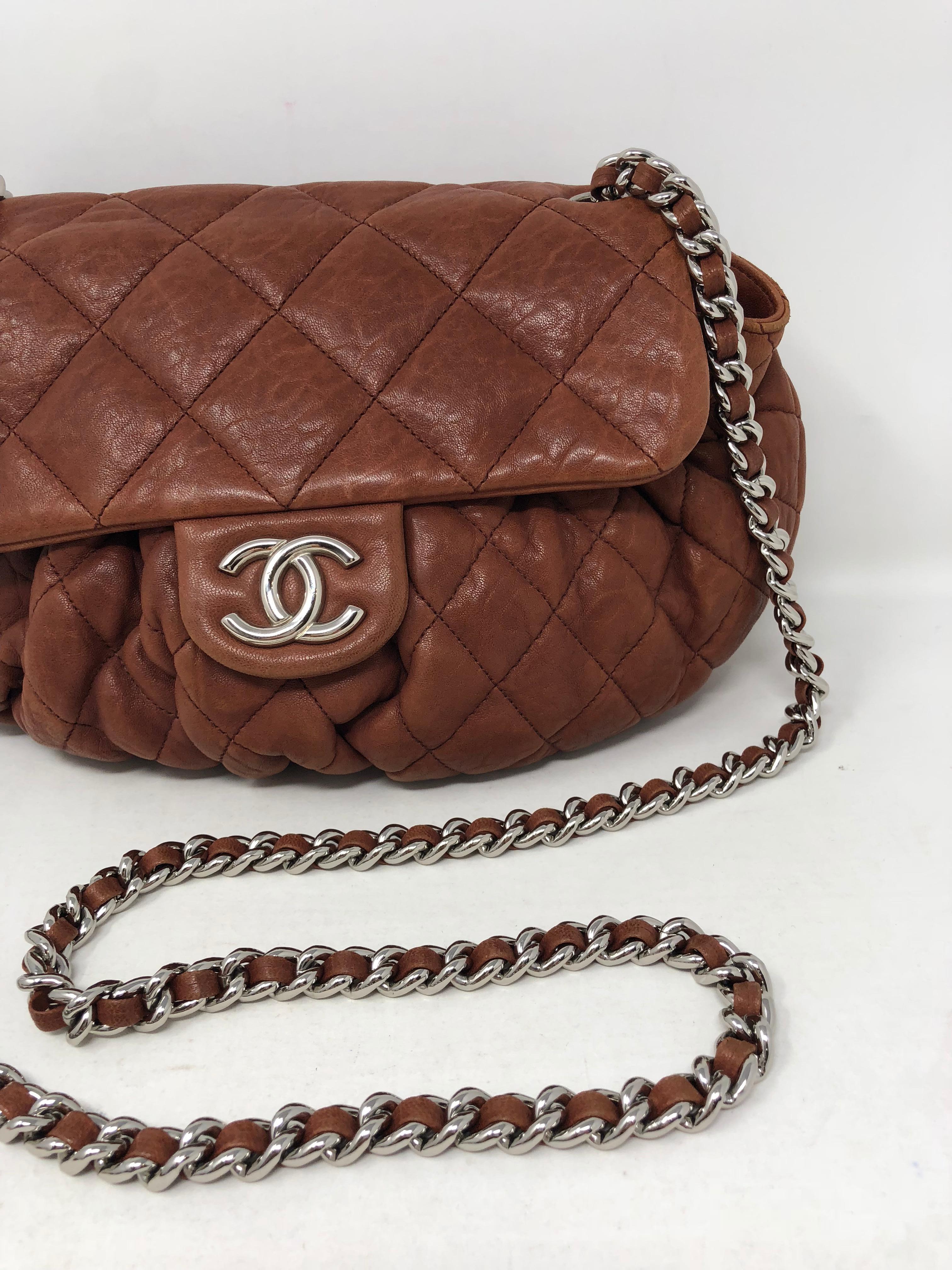 Chanel Chain Around Crossbody Bag in a beautiful brown color. Chestnut Brown color. Leather has a natural distress look to it. Can be worn crossbody. Good condition. Guaranteed authentic. 