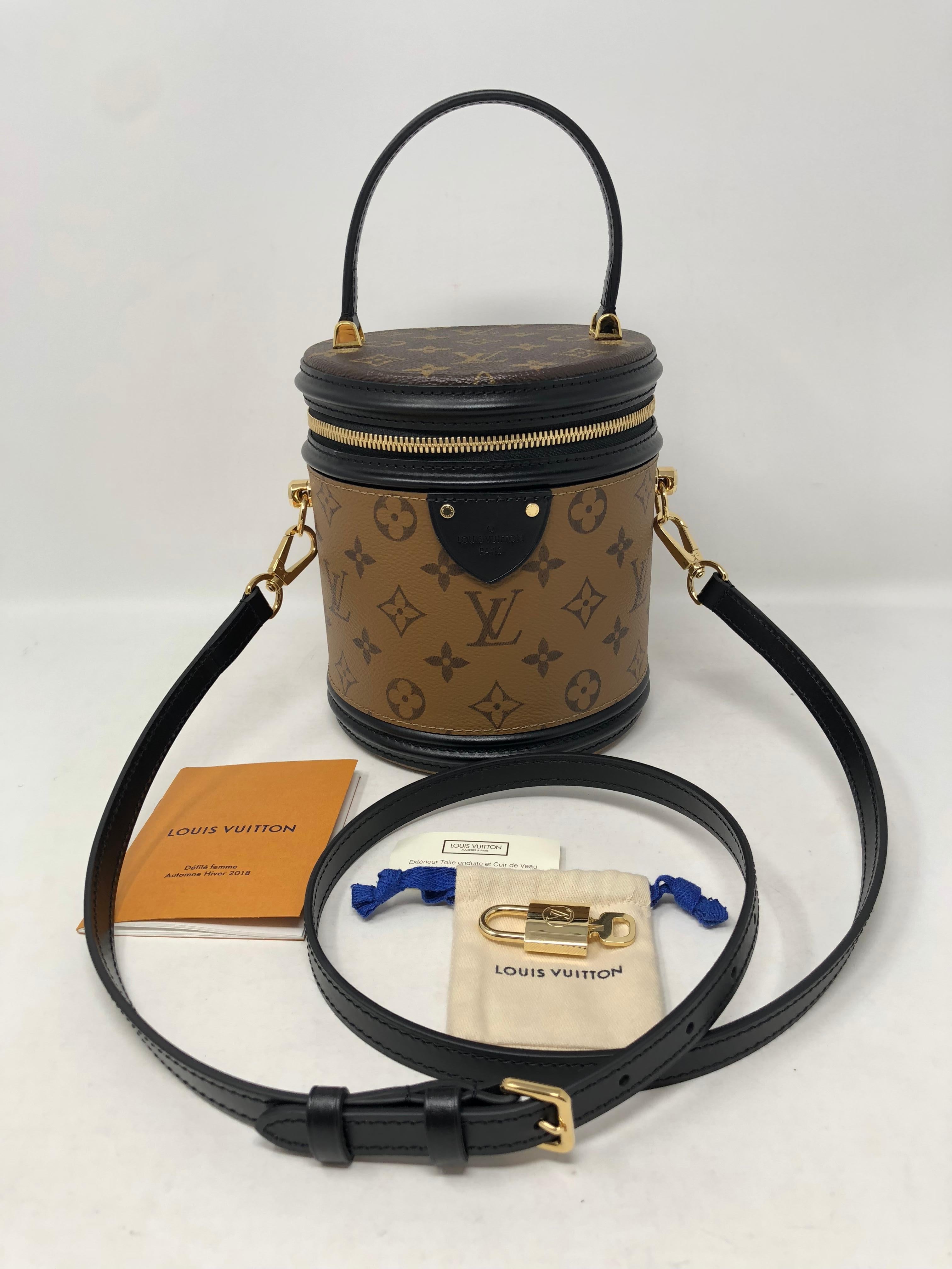 Louis Vuitton Reverse Monogram Cannes Bag. Limited and sold out. This exceptional bag is brand new and never carried. The bag features a leather top handle with black leather trim and an adjustable strap. Can be worn as a shoulder bag or carried