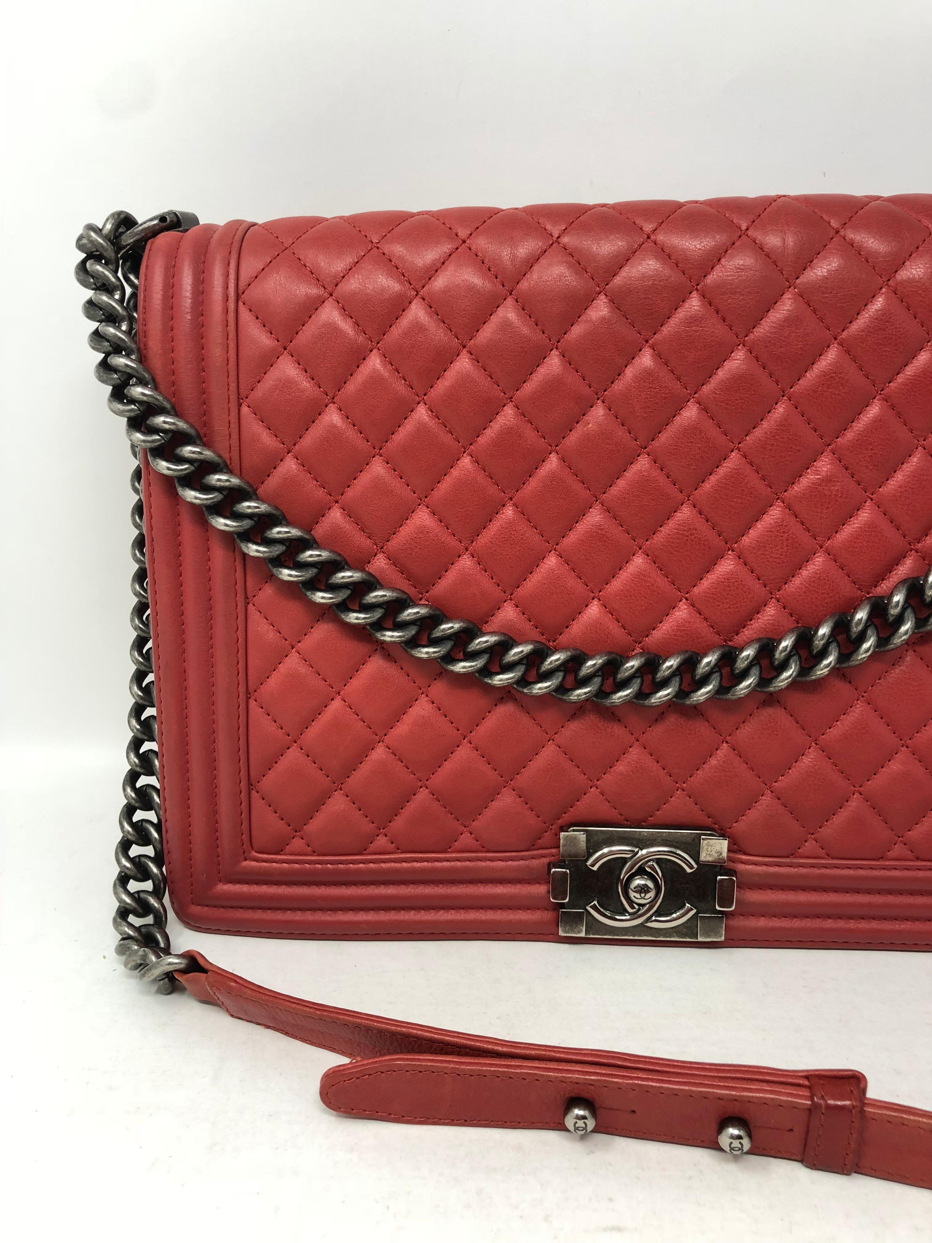 Chanel Red Boy Bag in calfskin leather and antique silver hardware. Large size Boy bag. Fair to good condition. Slight wear on corners. Guaranteed authentic. 