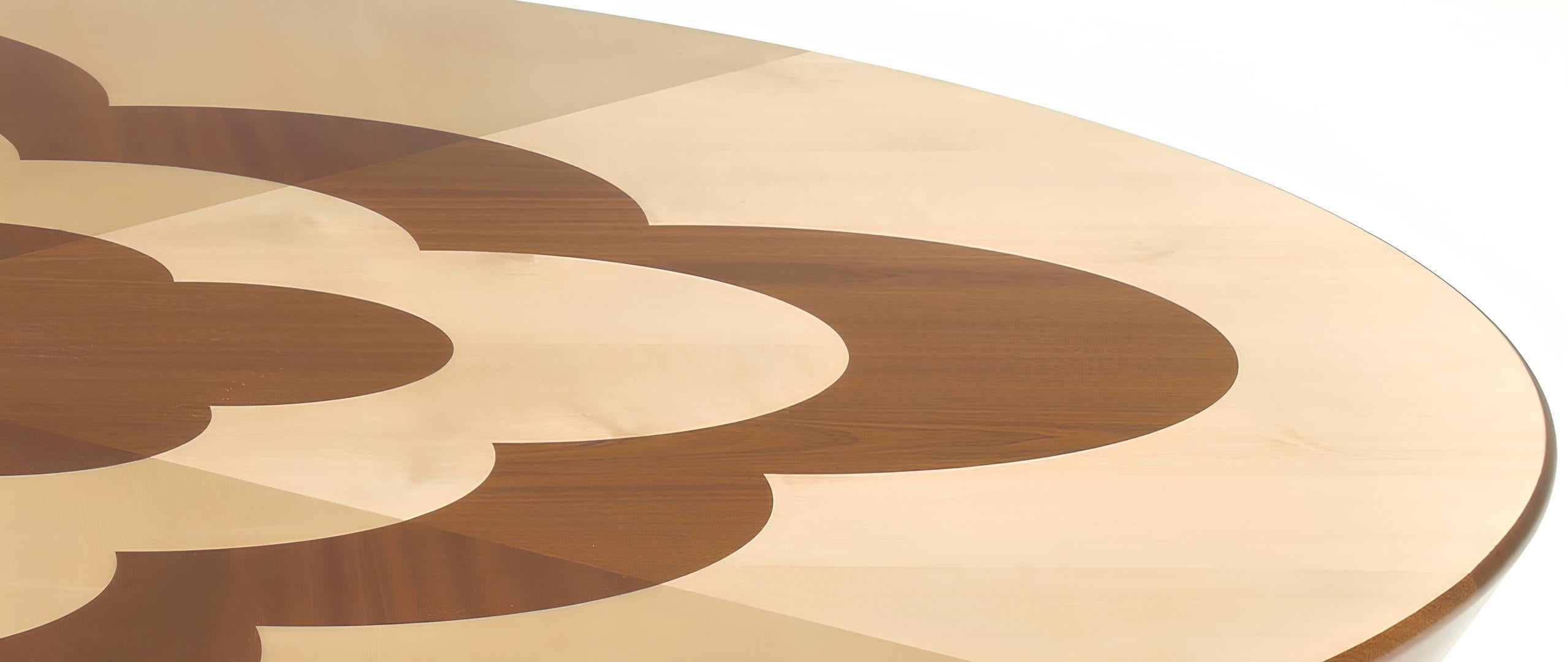 Archway CT is a cocktail table designed by the Argentinian designer Cristián Mohaded in 2022. Crafted with meticulous attention to detail, this round table is made from solid mahogany and maple wood, featuring an exquisite inlay design of a mahogany