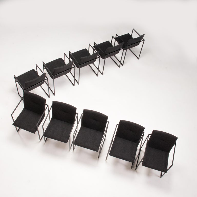 Originally designed by Burkhard Vogtherr for Arco in 2000, the Frame chair remains a classic piece of design.

Featuring a slimline, angular black metal frame, the chair gives the impression of the seat floating within it.

The sling style seat