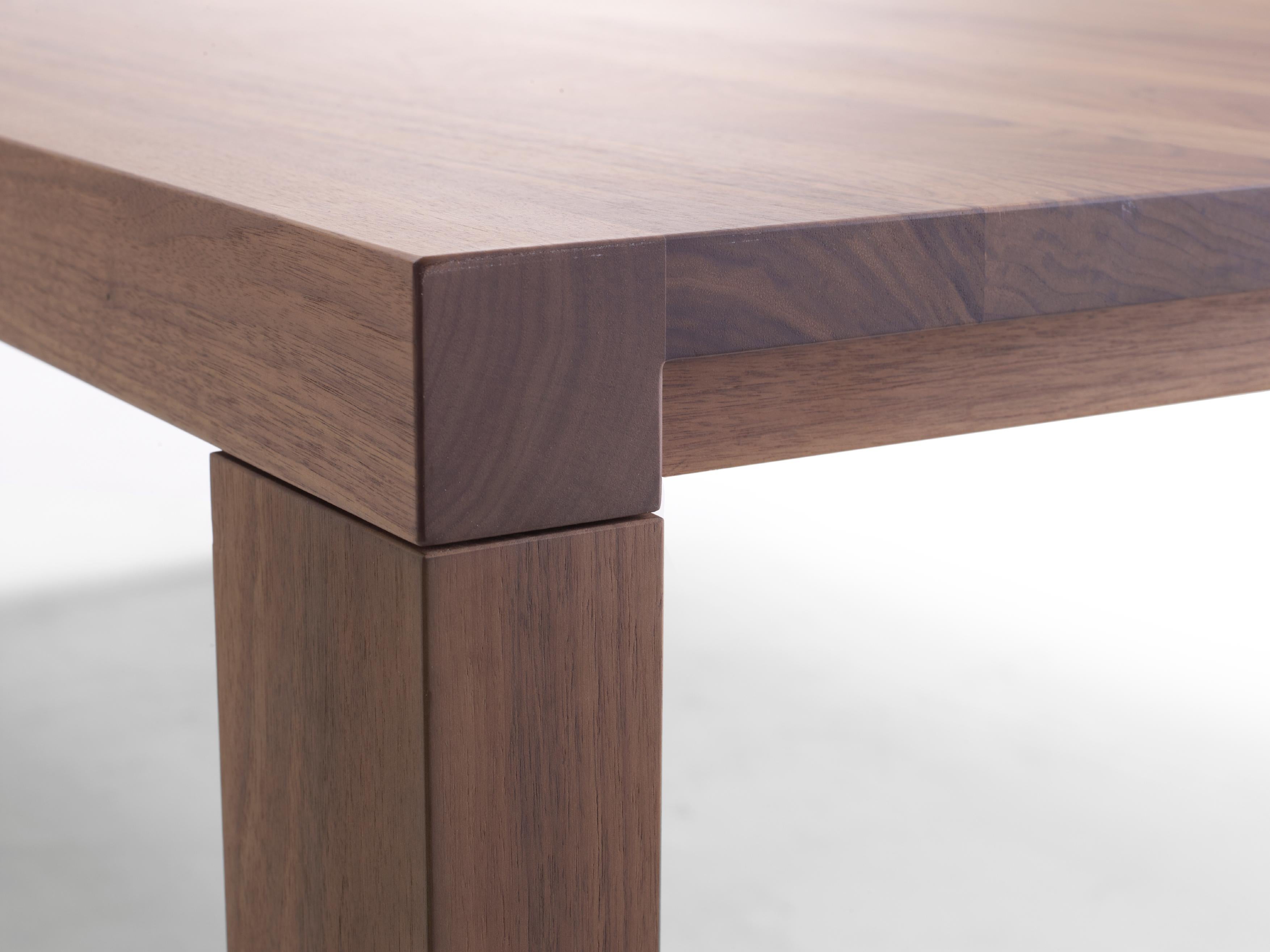 Essenza is a solid wood table with a pure and elegant design. It can also be turned into a high-end desk with a neat cable feed-through, cable management and privacy panel, and completed with a matching set of drawers from our Graphic Module range