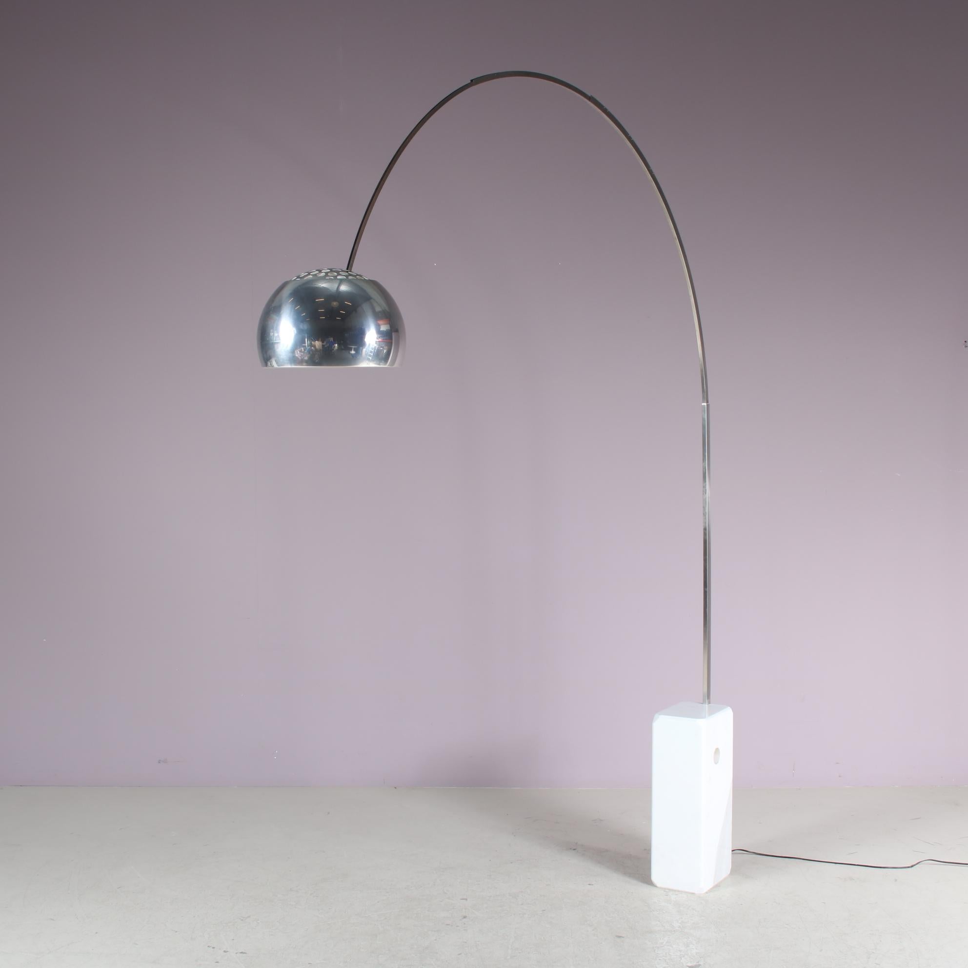 A beautiful floor lamp, model “Arco”, designed by Achille and Pier Giacomo Castiglioni manufactured by Flos in Italy around 1970.

Made of high quality chrome plated metal on a heavy white marble foot, holding a round shade at the end of the arced