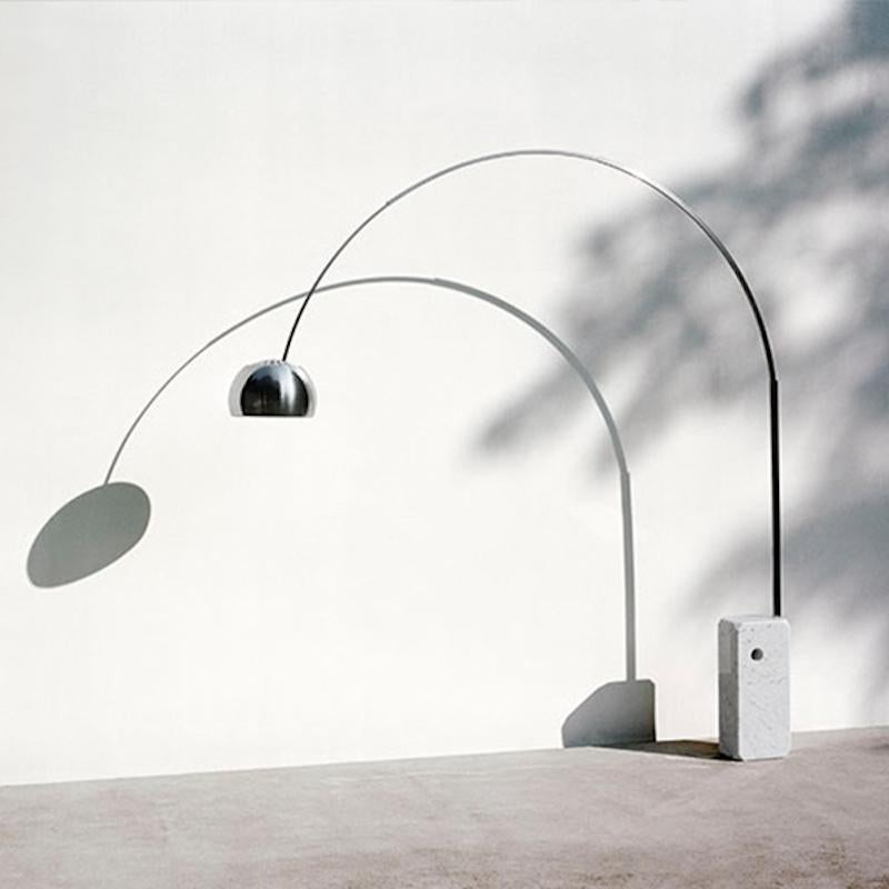 The brothers Castiglioni designed their iconic Arco lamp in 1962 to cast light far from a power source. Its marble base is so heavy it was made with a hole where a broom handle could be inserted to help lift it. This example is an original, not a