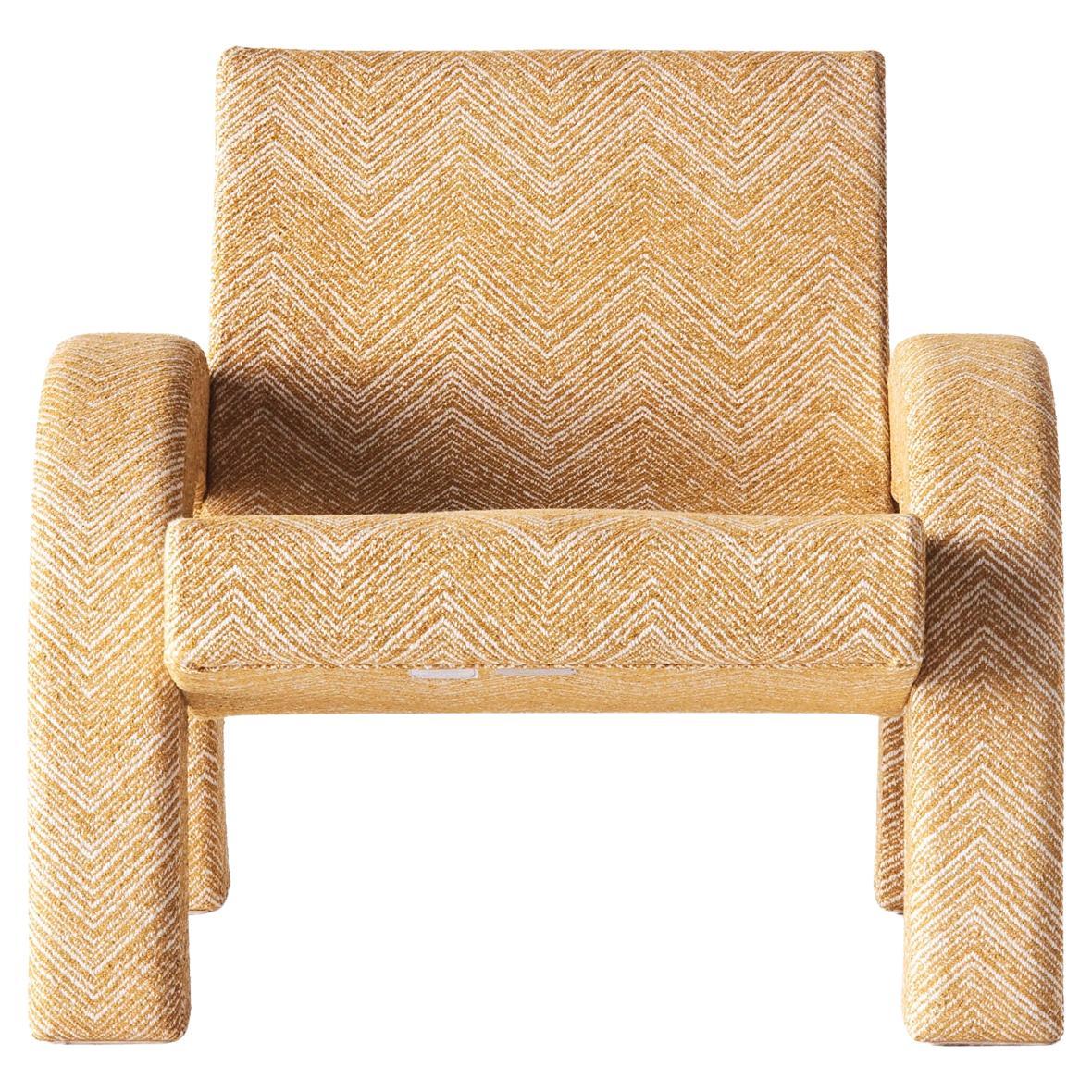 With inspiration from famous architecture such as the Arc de Triomphe in Paris and Arco De Triunfo in Barcelona, the Arco Lounge Chair was born. This version has been upholstered in a Teide Ochre fabric with a zig-zag pattern. The frame is made of