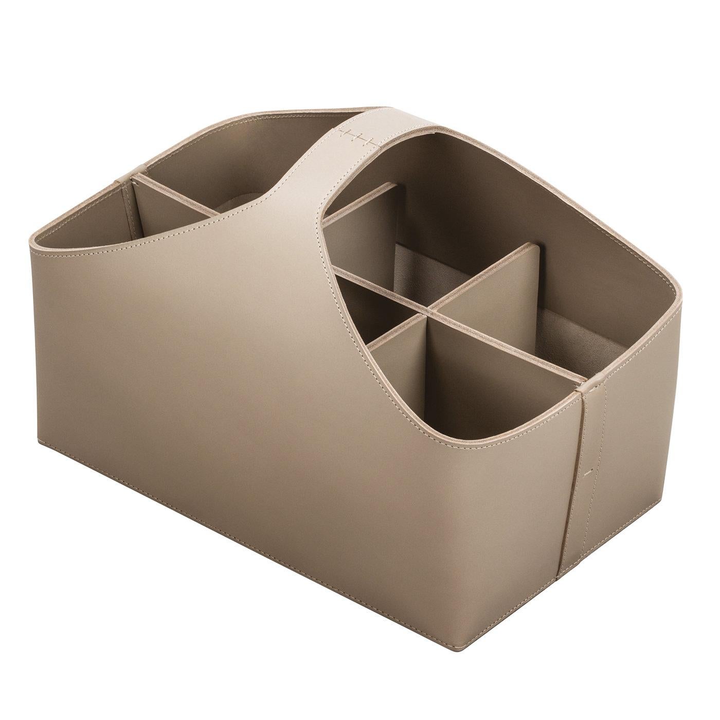 Handcrafted of high-quality leather in a light sand color, and detailed with tone-on-tone stitching, this caddy basket can be displayed anywhere in a modern or traditional decor. From organizing makeup essential to desk or media accessories, this