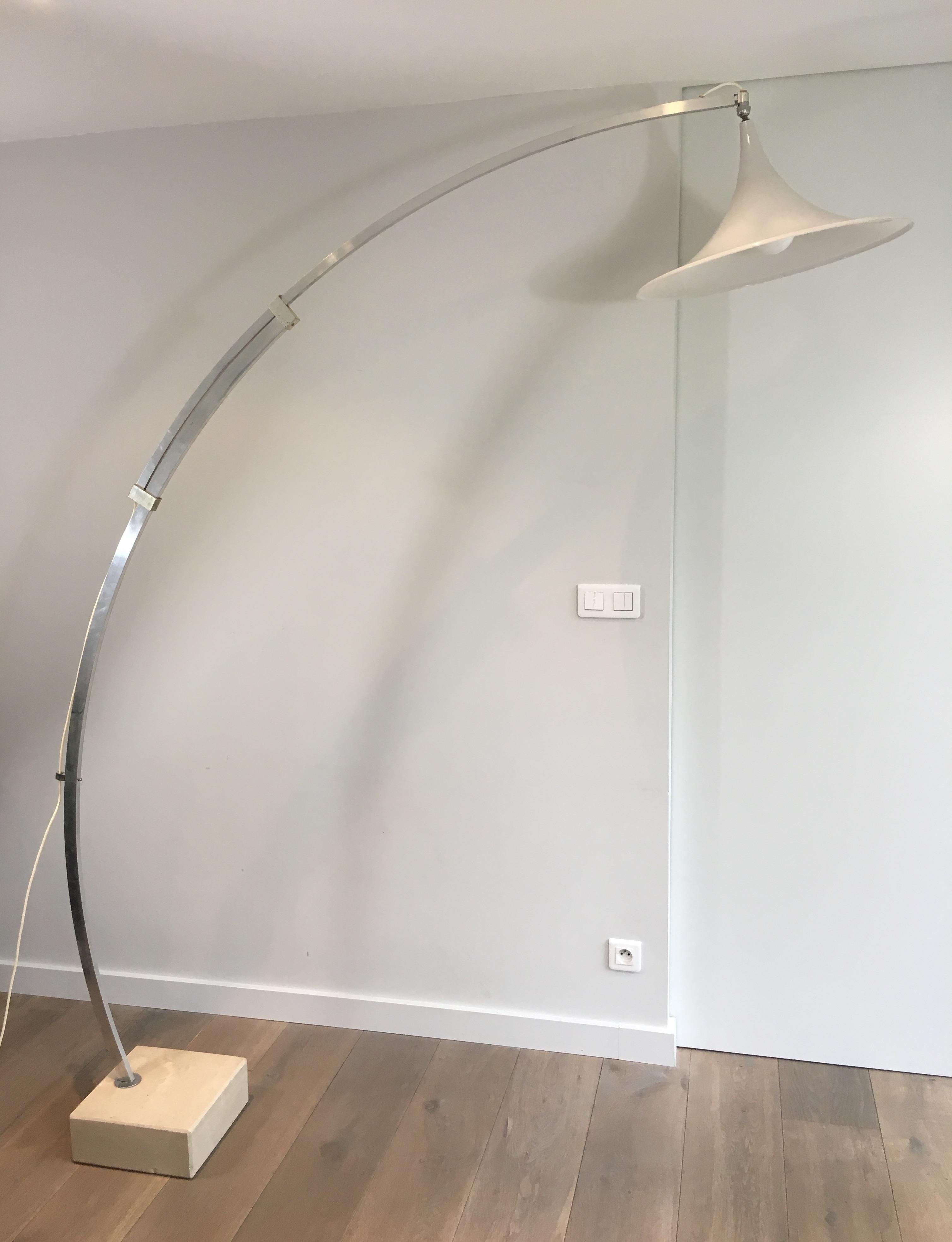 This unusual Arco style floor lamp is made of brushed aluminium with a conical white plastic reflector and a square marble base. This is a French. work, circa 1970.