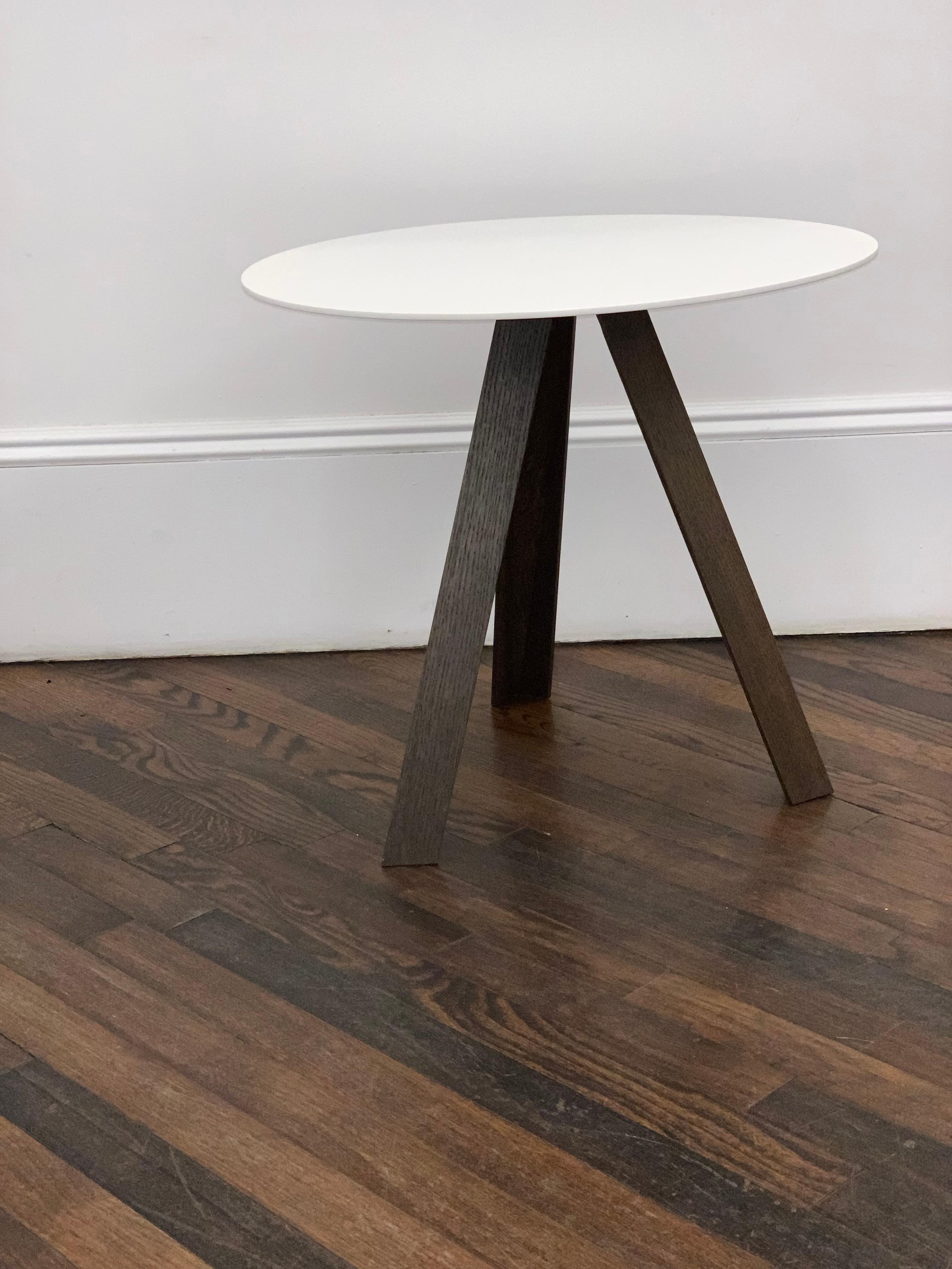 Tre is a playful piece of furniture that can be installed anywhere as handy occasional table. As the name Tre suggests, the number three is central to the design. 
Walnut stain base.