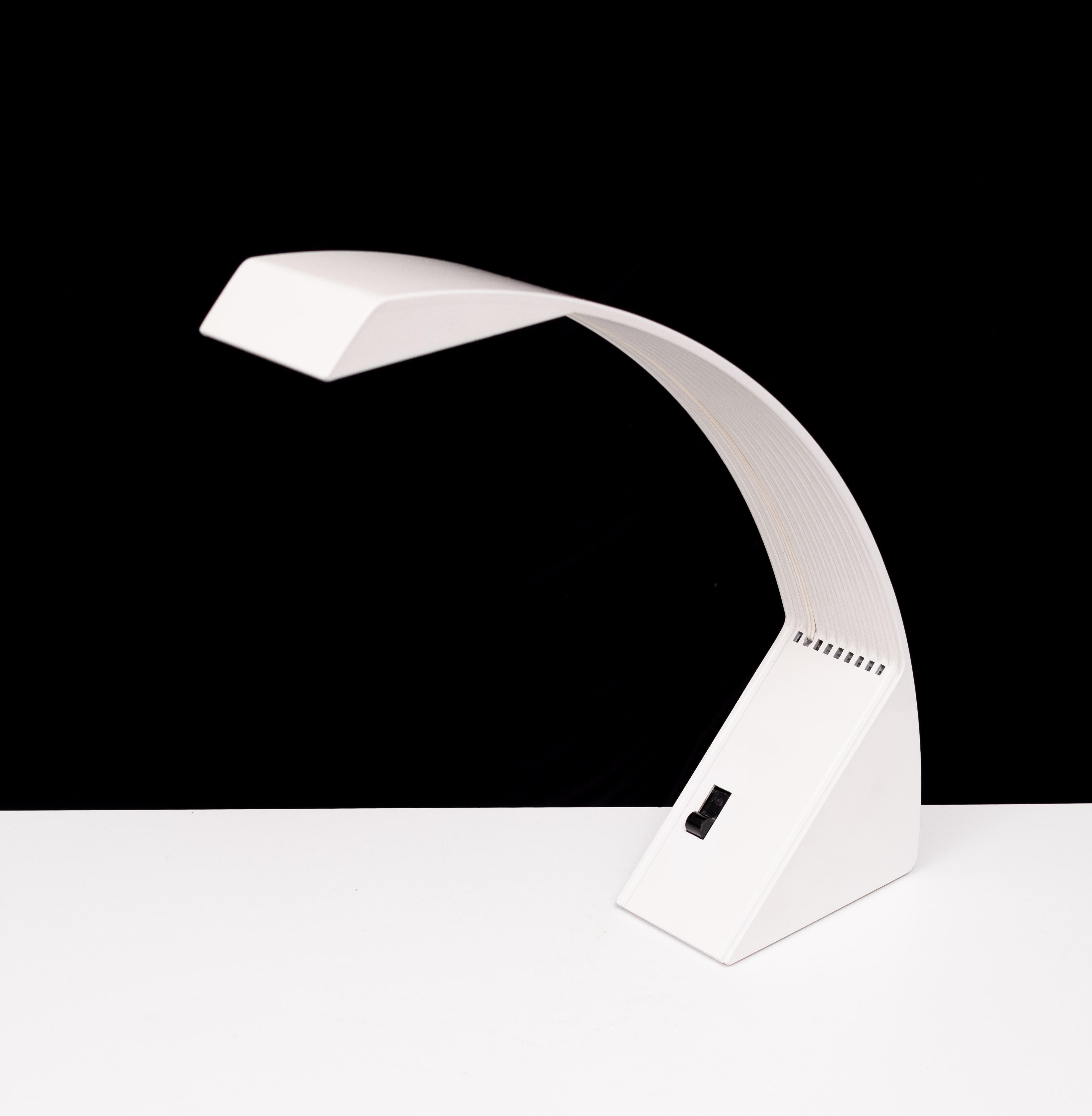 Beautiful Post Modern halogen table lamp .model Arcobalena  love the simple curved shape of the lamp. Two lighting positions: low and strong, Design by marco zotta  manufactured by Cil Italia . 1980s . 
very good condition . signed .
is part of the