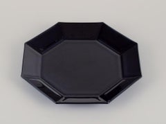 Arcoroc, France. Set of four octagonal plates in black glass.