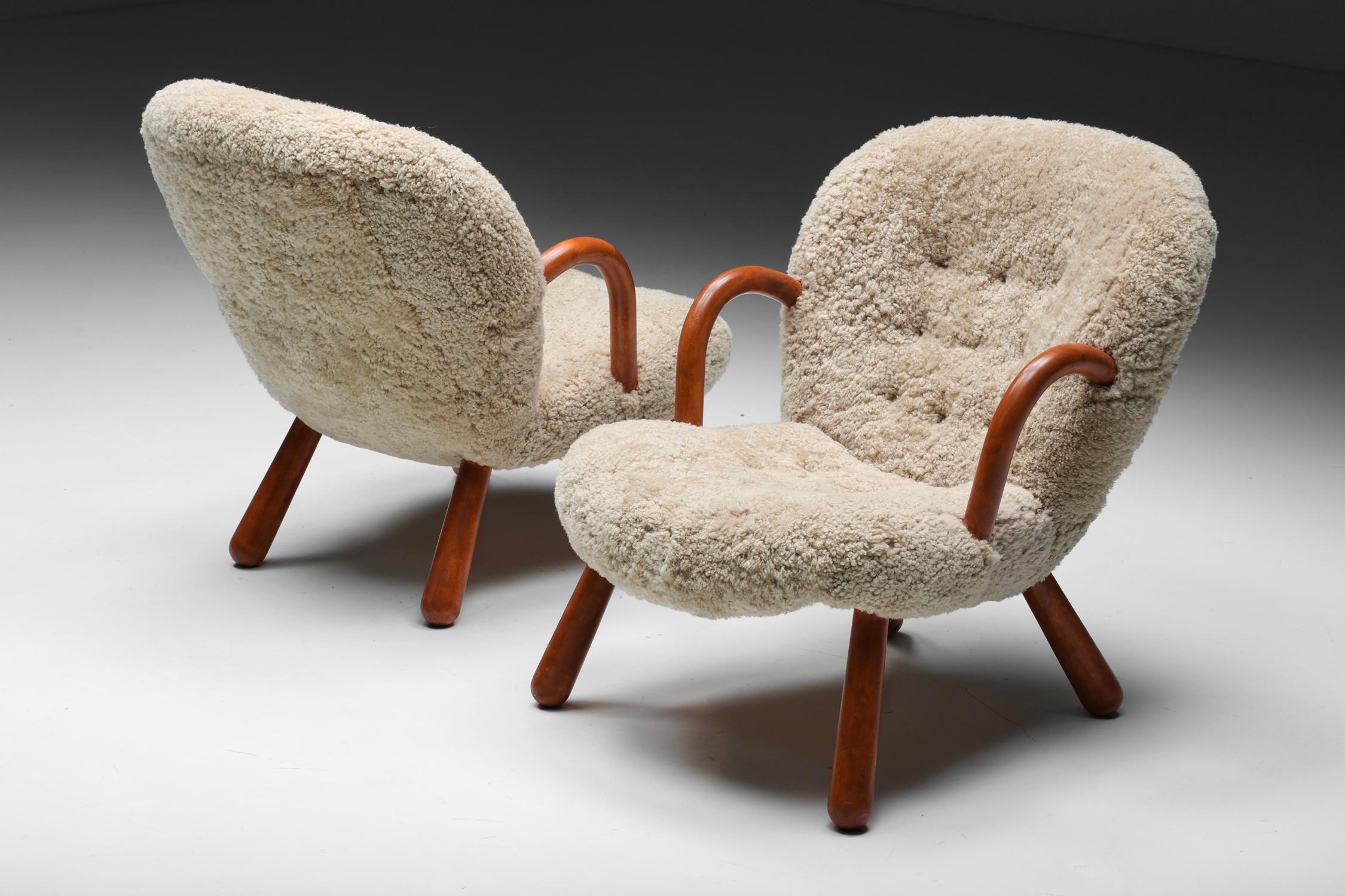 Arctander clam chair in Sheepskin by Philip Arctander, Denmark, 1944

The Arctander clam chair, also known as the “Muslingestol”, is easily recognizable by its rounded arms, club-shaped legs, and curved, slightly tilted backrest upholstered in the