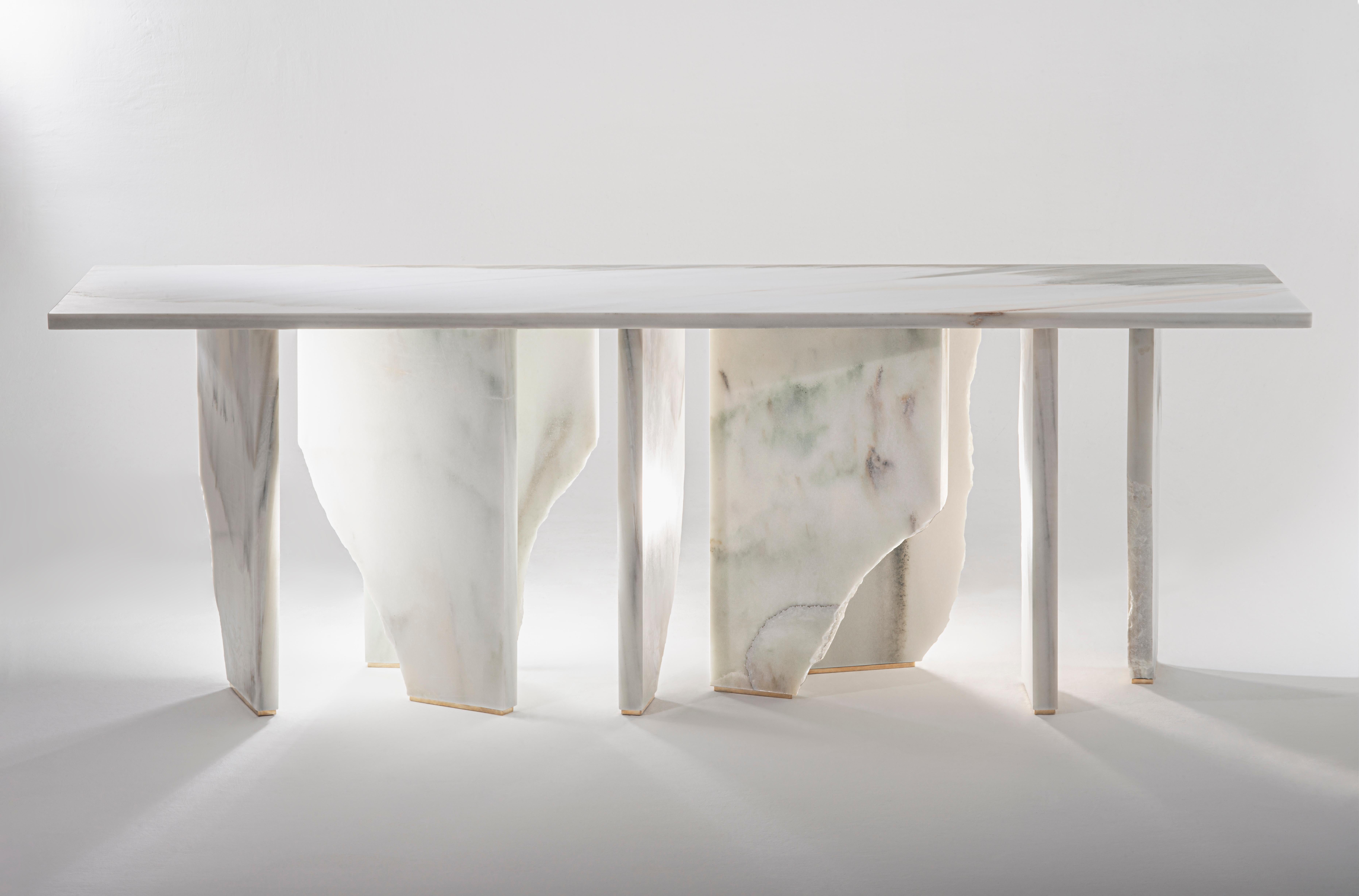 Like a monumental iceberg, the Arctic Console seems to float in the space. A unique piece made out of solid marble from the South of Spain, a warm land that provides, in appearance, this frozen stone. The stone – icy and crystalline - is letting the