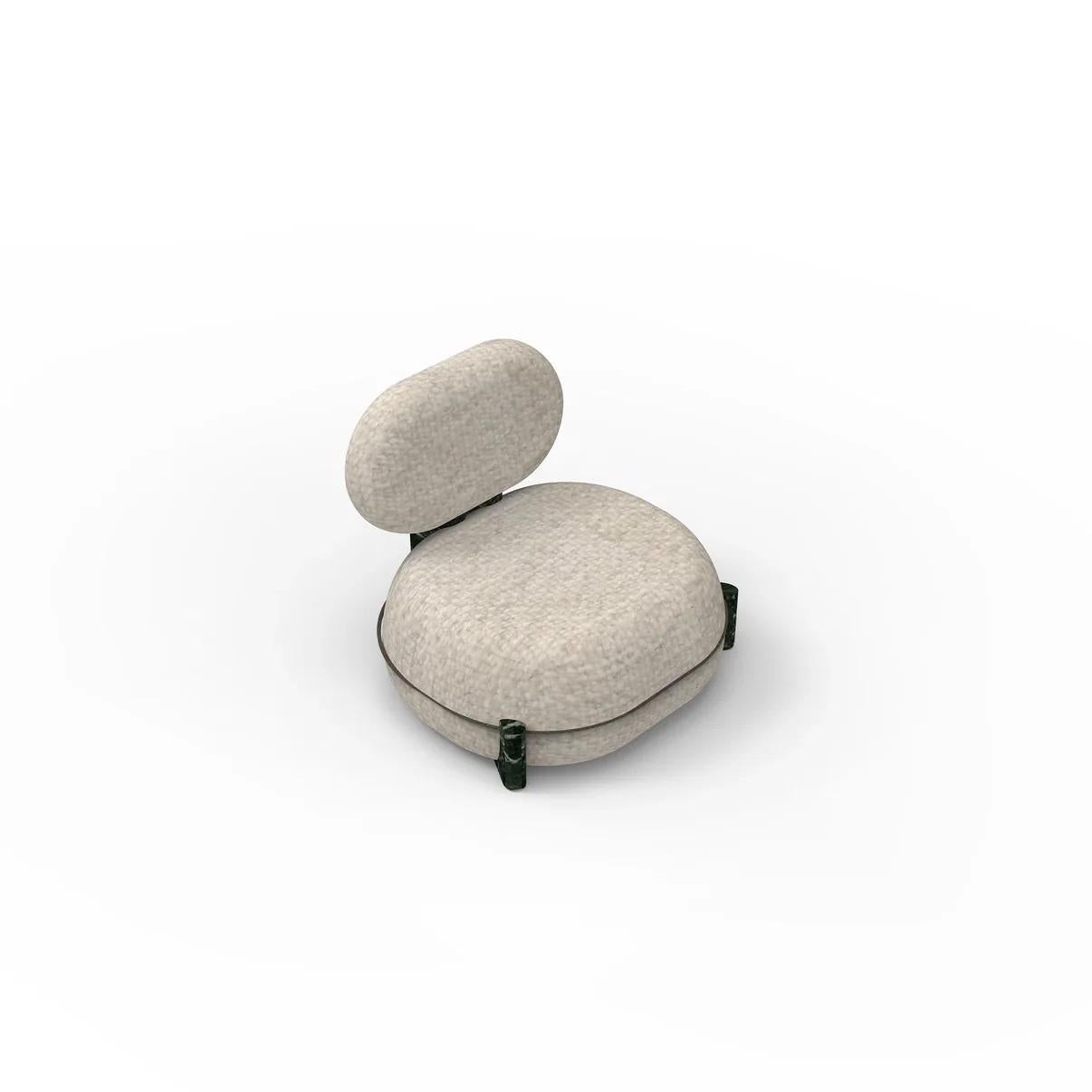The Arcus Accent Chair embodies refined comfort and artistic craftsmanship, merging soft upholstery with the strength of natural stone. Its organic silhouette, supported by meticulously polished Verde Alpi stone legs, creates a striking balance