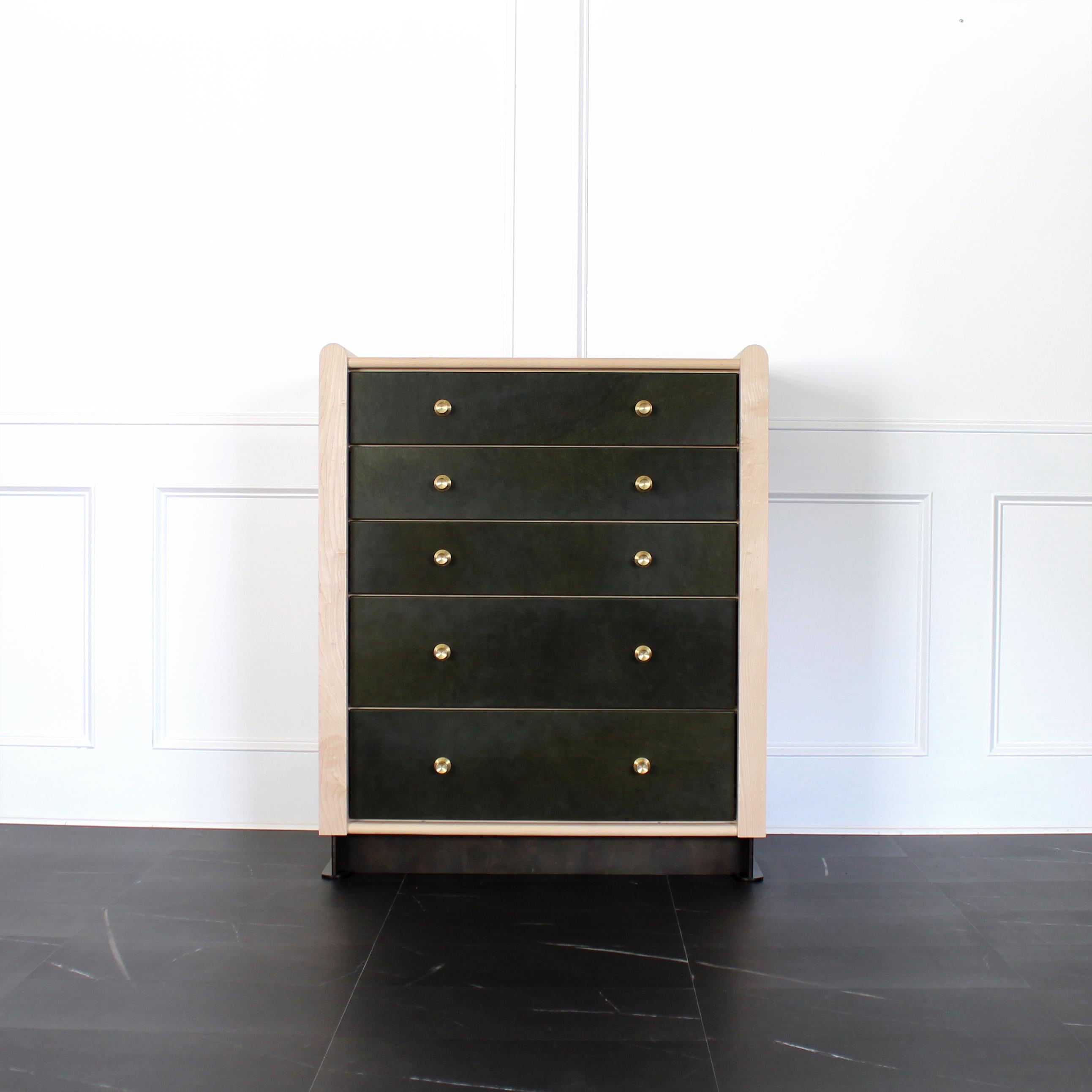 Alton Highboy by Crump and Kwash 

Features a solid wood case / oiled or acrylic finish / leather wrapped drawer fronts  / premium, full extension, soft close drawer slides / solid maple, dovetailed drawer boxes / solid brass pulls / patinated steel