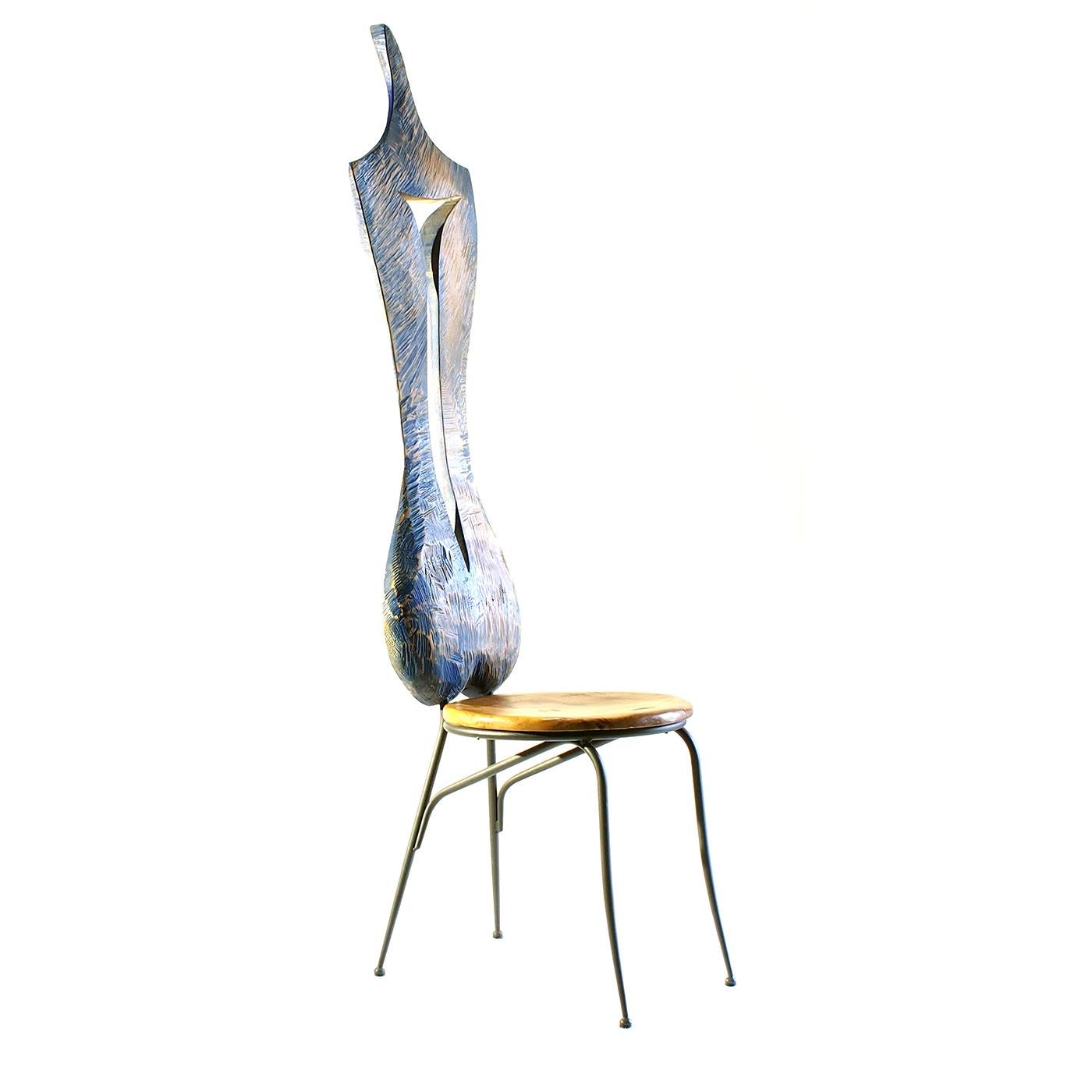 Paying homage to the sensual curves of the female body, the sculptural backrest of this unique chair is entirely crafted by hand of maple wood with a sinuous hollow space in the center that adds a dynamic movement and a light blue whitewash finish.