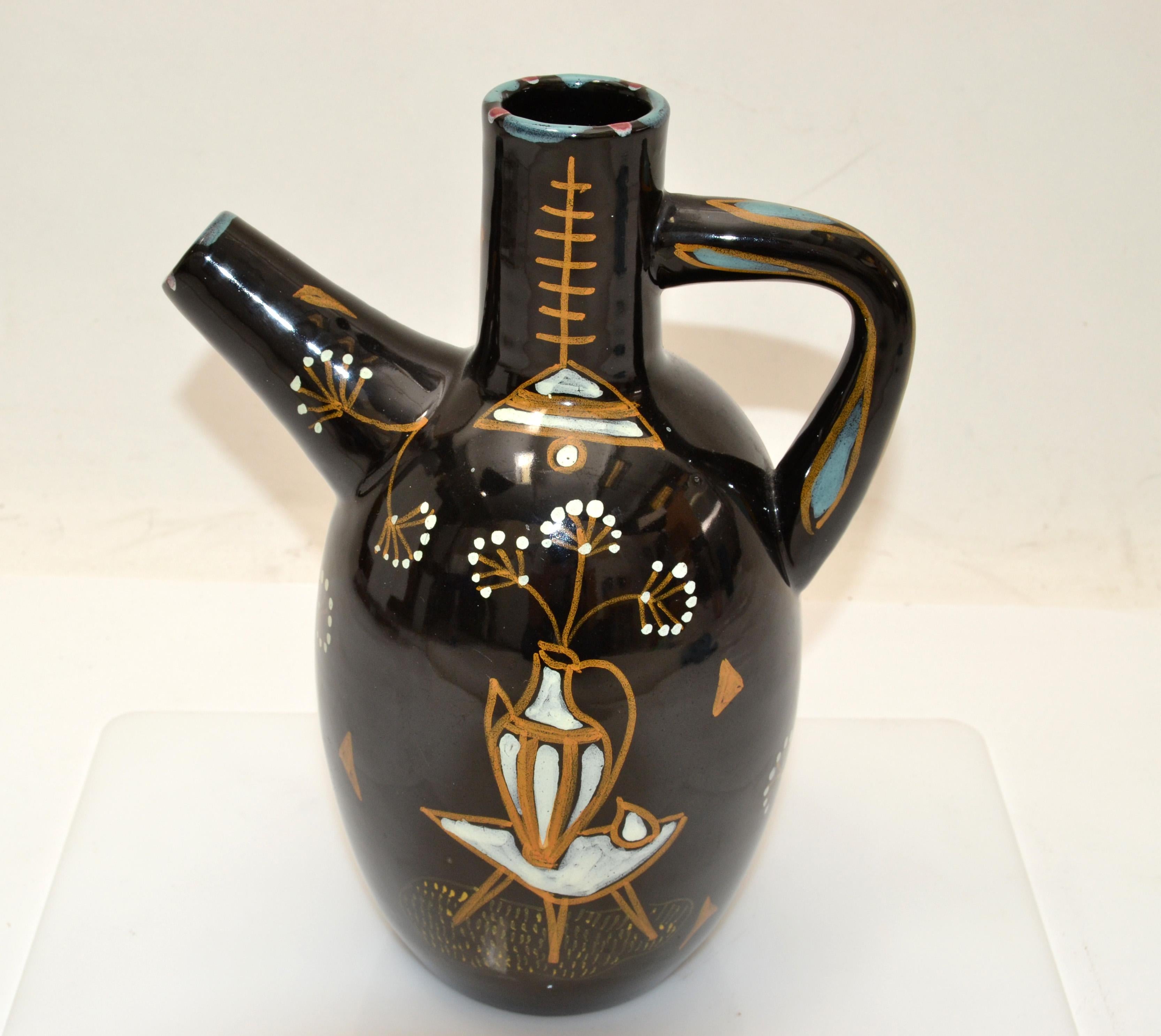 ARDALT Italy Mid-Century Modern tall Ceramic vase, vessel, decanter in black Gold, white & turquoise hand painted Decor.
Italian Pottery Glazed inside and outside made in the late 1970.
At the Base it is numbered 5757 and marked ARDALT Italy.
This
