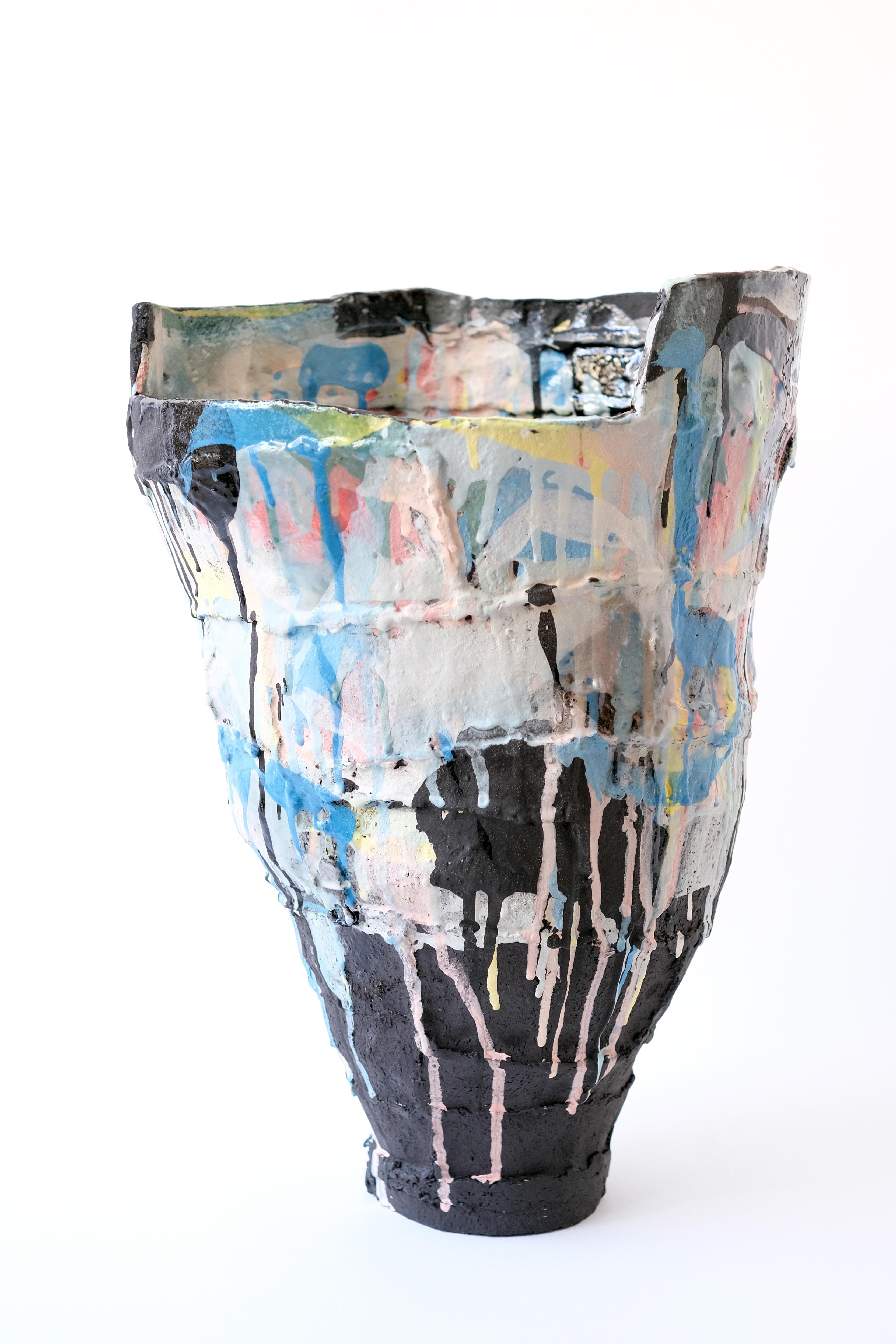 Ardea Cinerea vase by Elke Sada
Unique piece
Dimensions: W 31 x D 32 x H 45 cm
Materials: black grogged clay, coloured slips, transparent glaze.

What is fascinating and striking about Elke Sada’s ceramic art is not only the radiance of