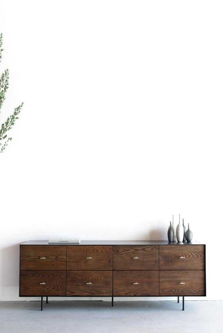 This Dresser is Custom Made in Los Angeles. Industrial steel casing is sheered to size and attached to a substrate. Wood is cut to size and joined to drawer face. Four drawers with brass pulls and soft close slides. 
OAK + INDUSTRIAL STEEL + BIRCH