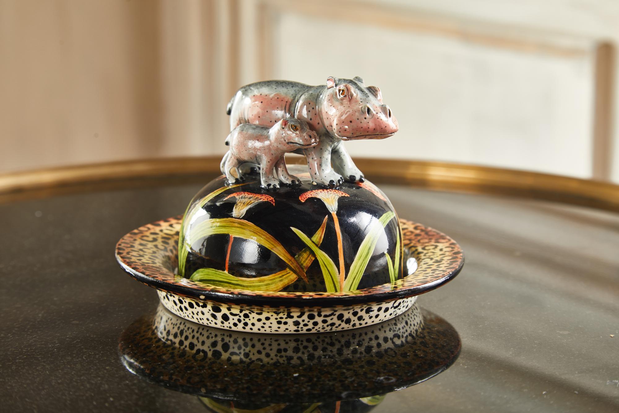 This artwork brings to life the land mammals, capturing the sorrowful reality in their expression.

This fancy butter dish is a true gem, with its decorative plate displaying a dark background, beautiful blossom, and Cheetah lookalike skin