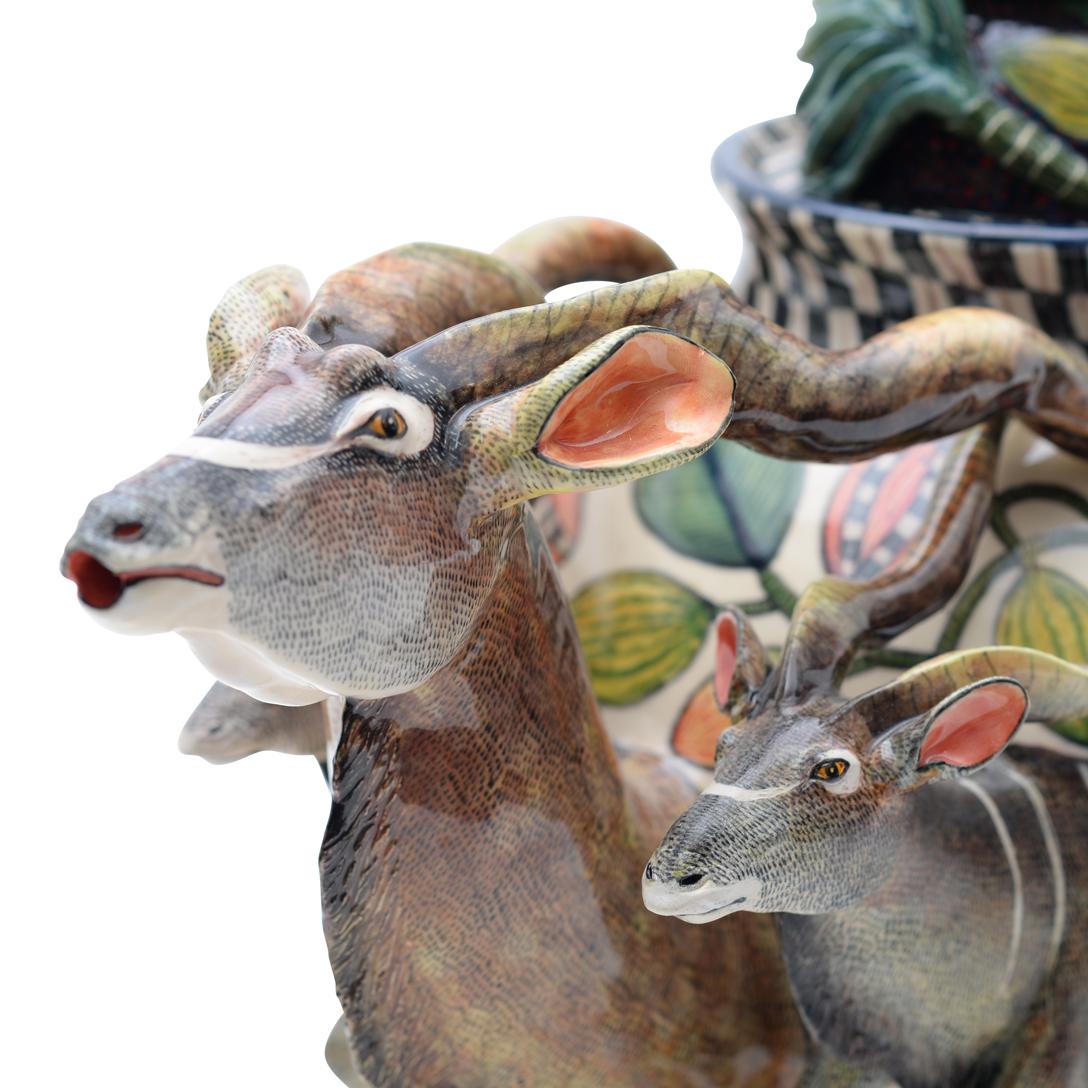 Introducing the Kudu Teapot by Ardmore Ceramics, a masterpiece that seamlessly blends art and functionality. Hand-sculpted by the talented Alex Sibanda and adorned with the artistic touch of Slindile Mchunu in South Africa, this large ceramic teapot